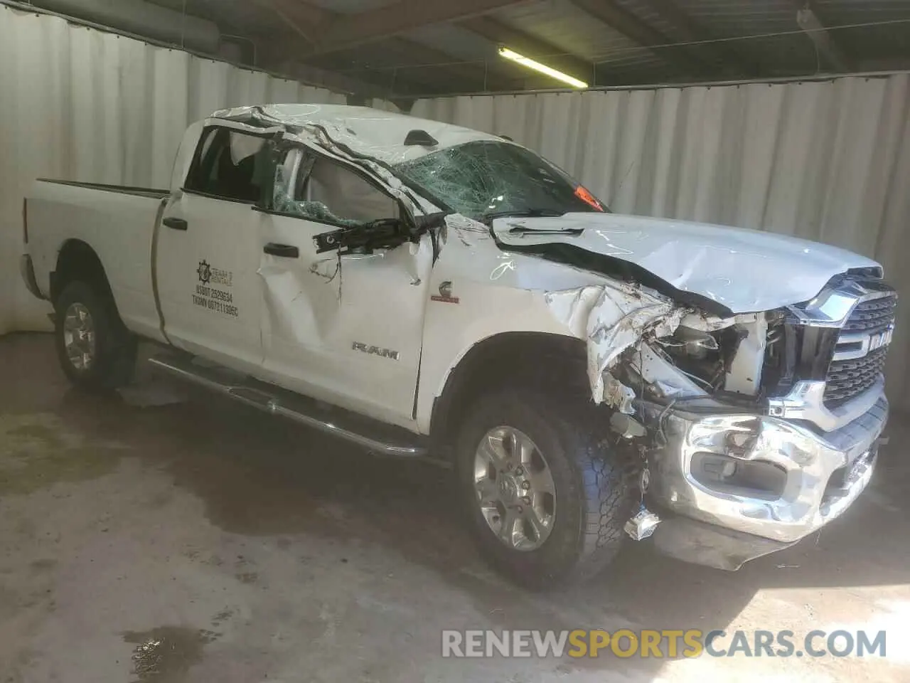 4 Photograph of a damaged car 3C6UR5DL2RG101498 RAM 2500 2024