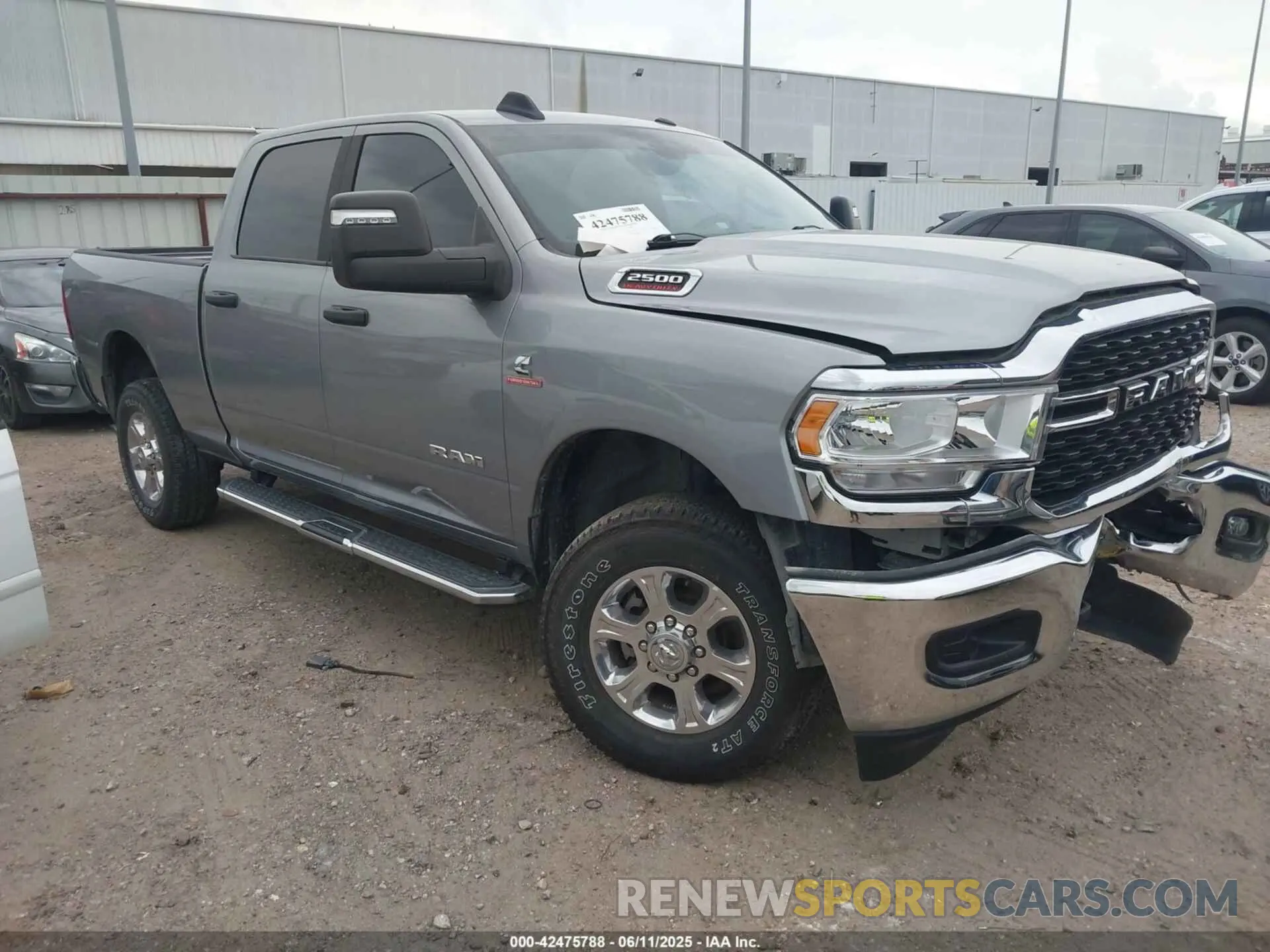 1 Photograph of a damaged car 3C6UR5DL2RG233158 RAM 2500 2024