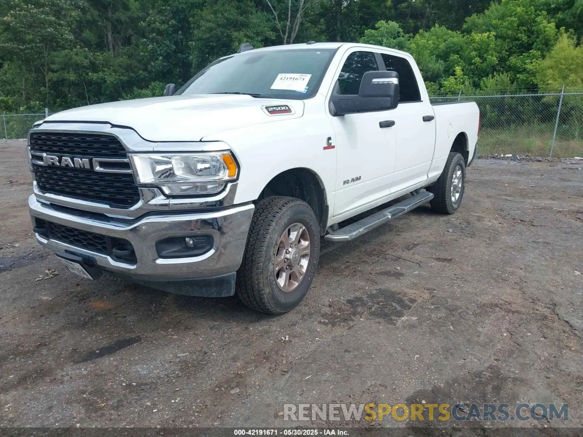 2 Photograph of a damaged car 3C6UR5DL2RG340744 RAM 2500 2024