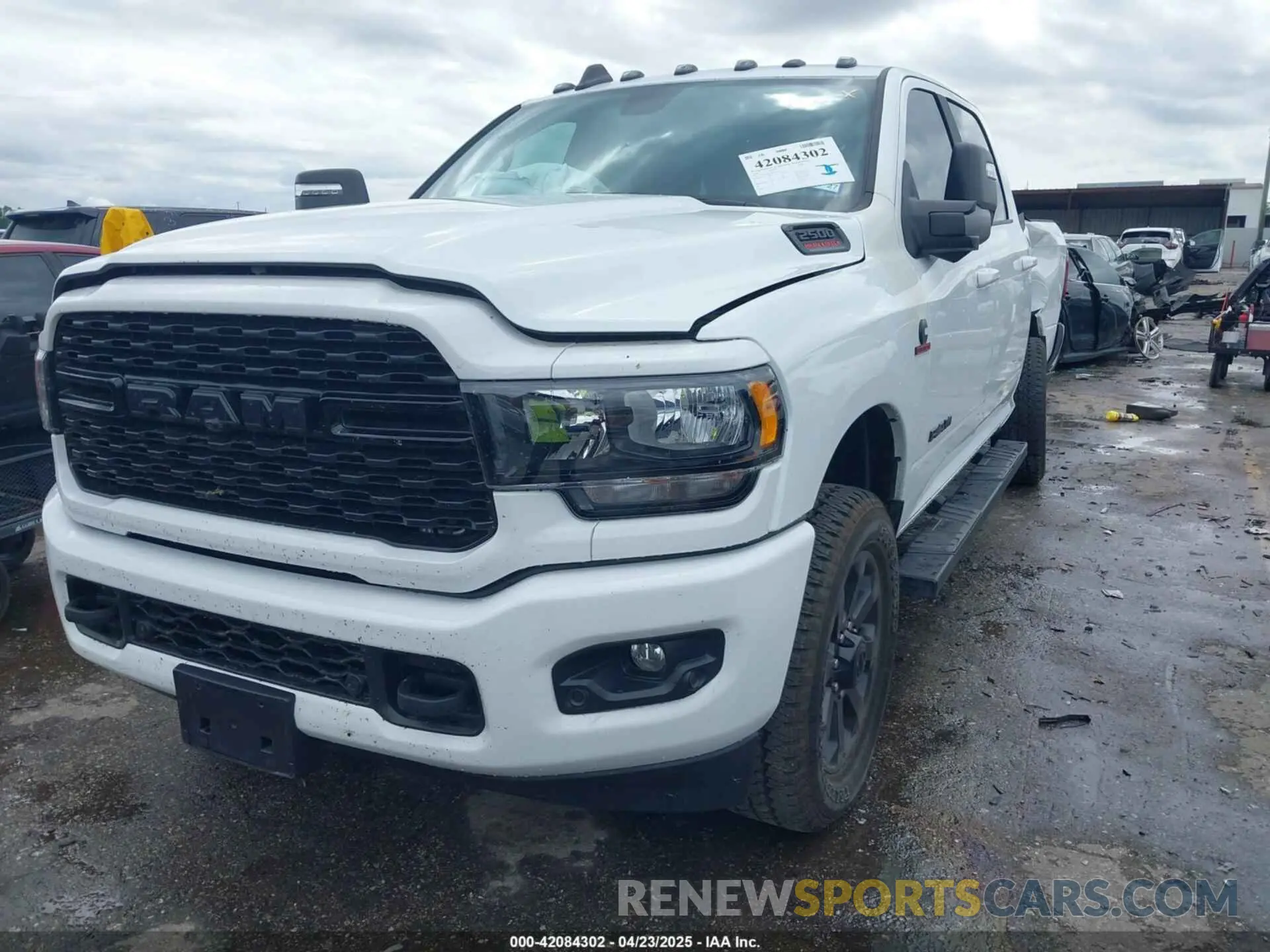 2 Photograph of a damaged car 3C6UR5DL2RG378362 RAM 2500 2024