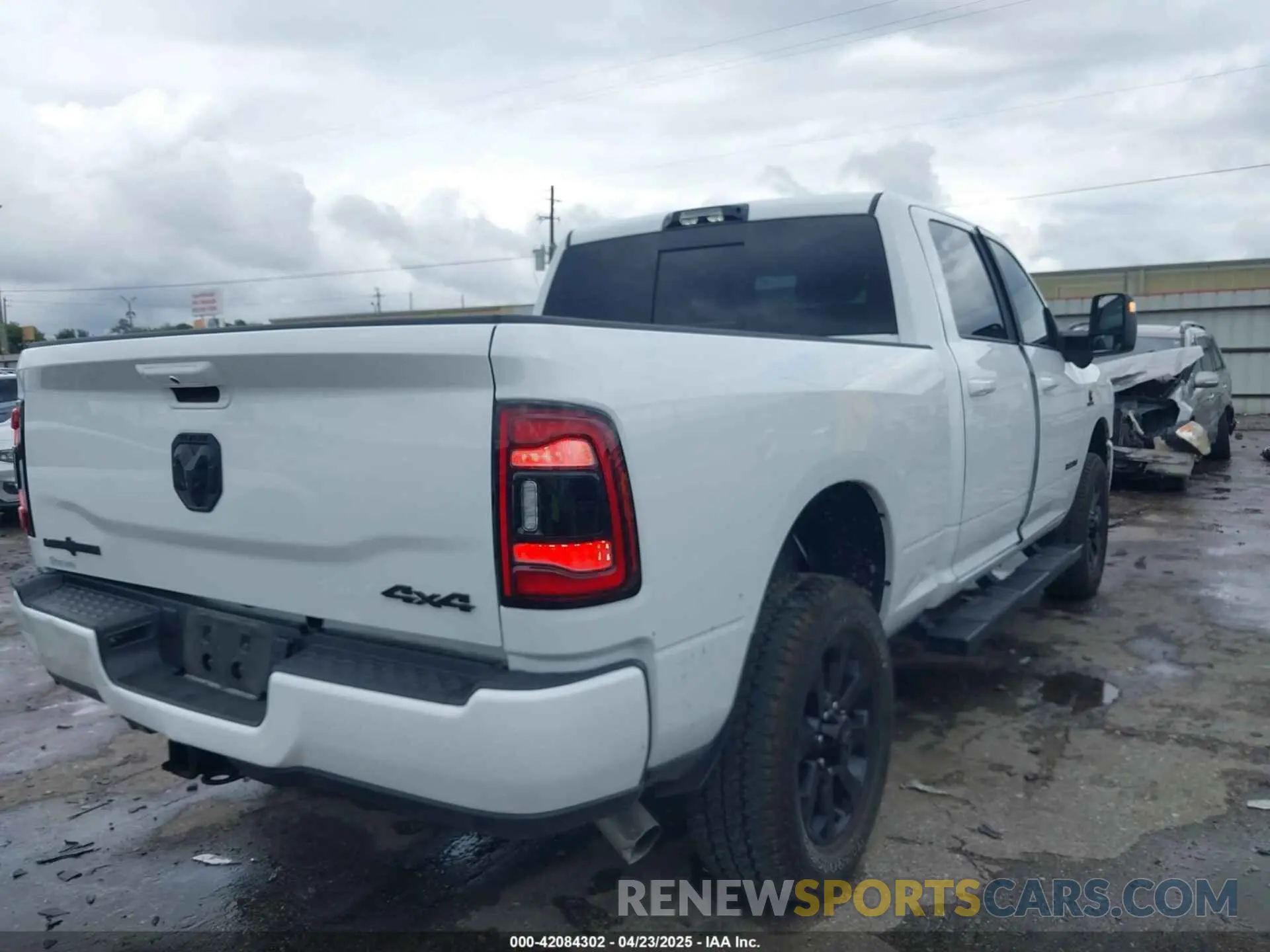 4 Photograph of a damaged car 3C6UR5DL2RG378362 RAM 2500 2024