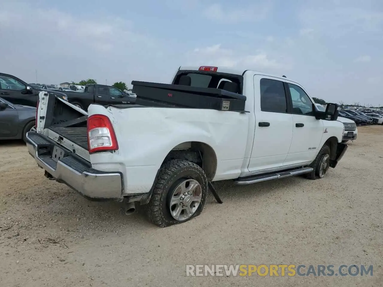 3 Photograph of a damaged car 3C6UR5DL3RG176923 RAM 2500 2024