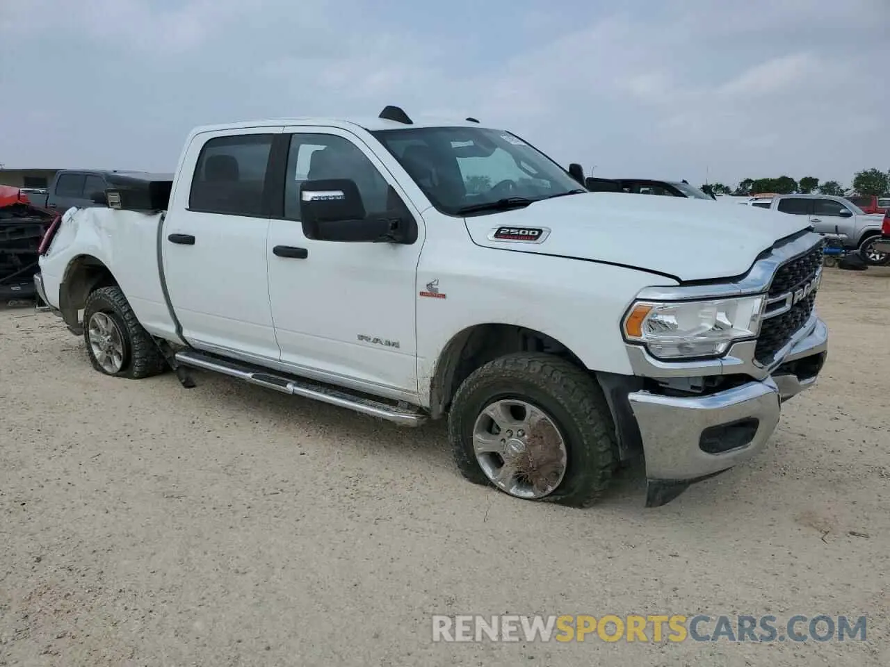 4 Photograph of a damaged car 3C6UR5DL3RG176923 RAM 2500 2024