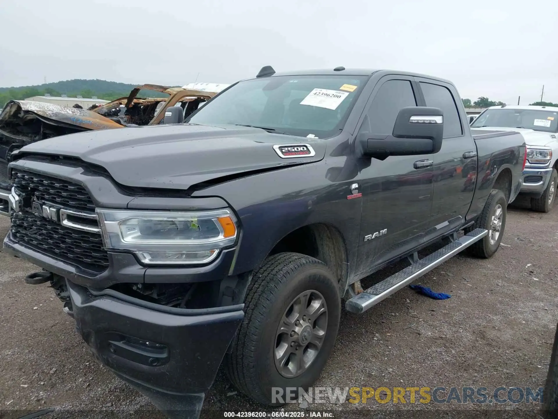 2 Photograph of a damaged car 3C6UR5DL4RG202719 RAM 2500 2024