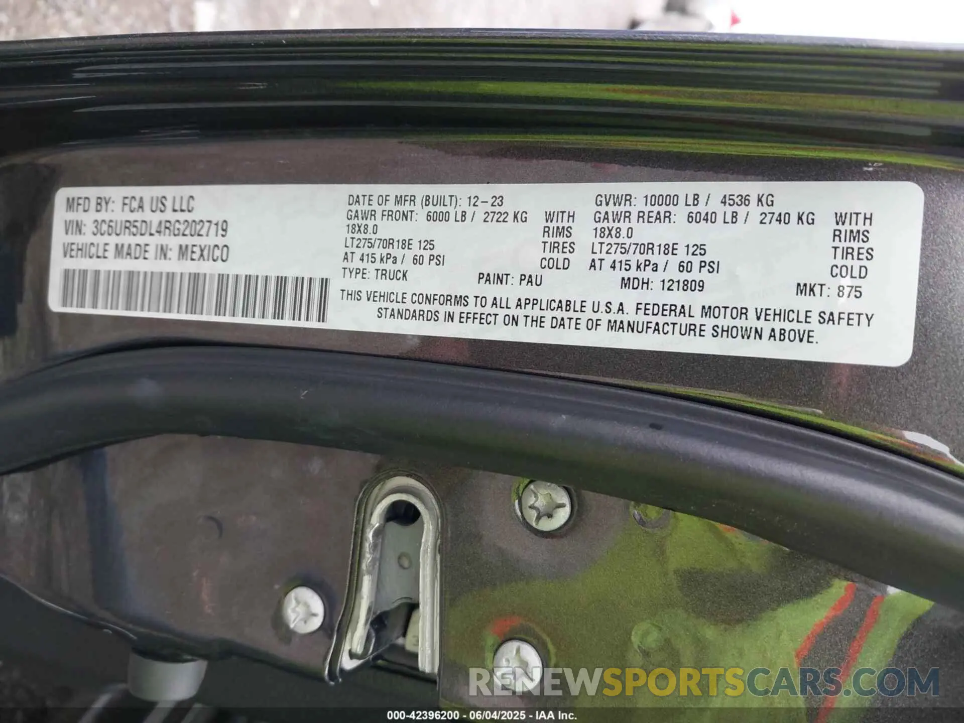 9 Photograph of a damaged car 3C6UR5DL4RG202719 RAM 2500 2024