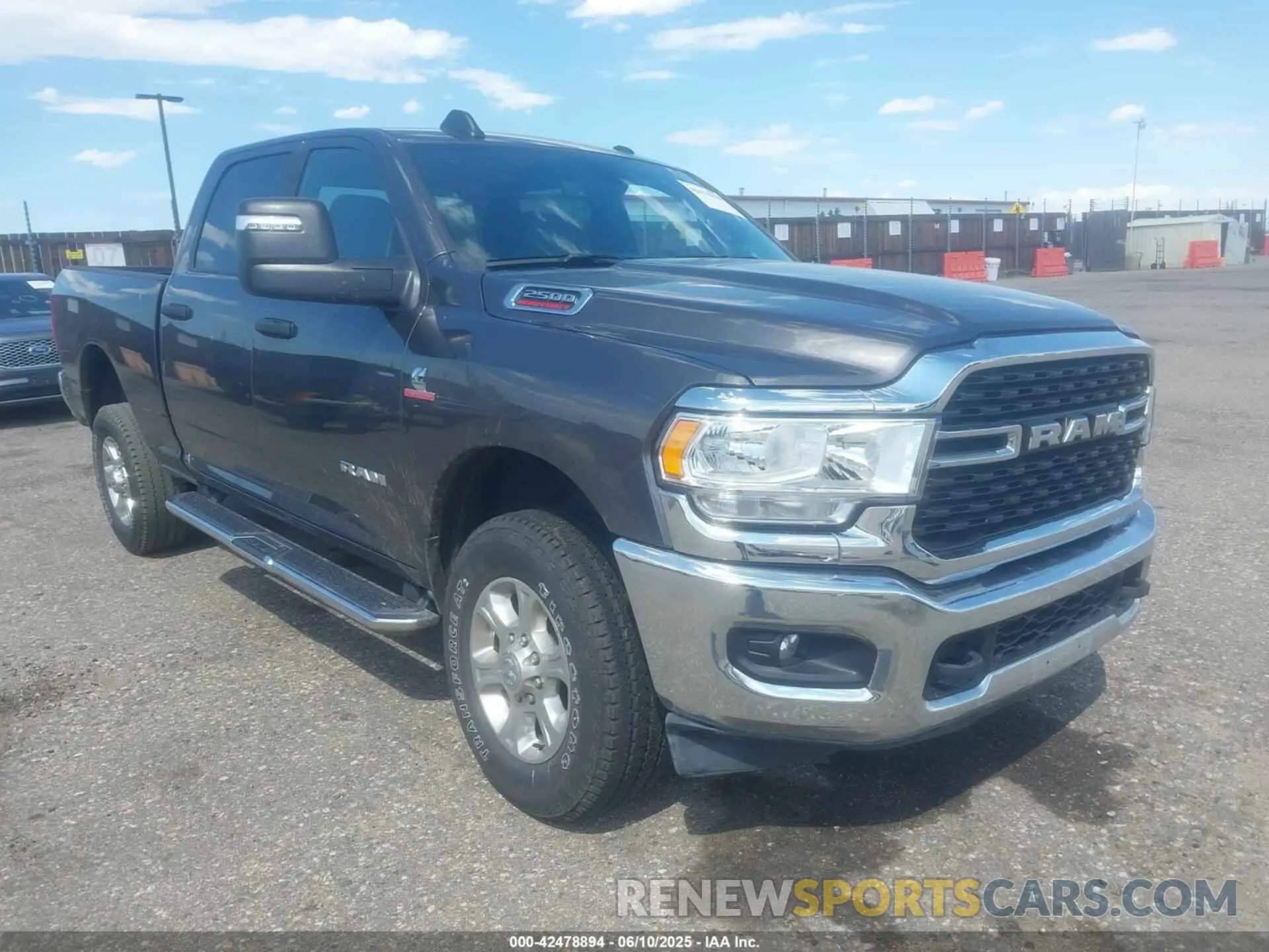 1 Photograph of a damaged car 3C6UR5DL4RG303677 RAM 2500 2024