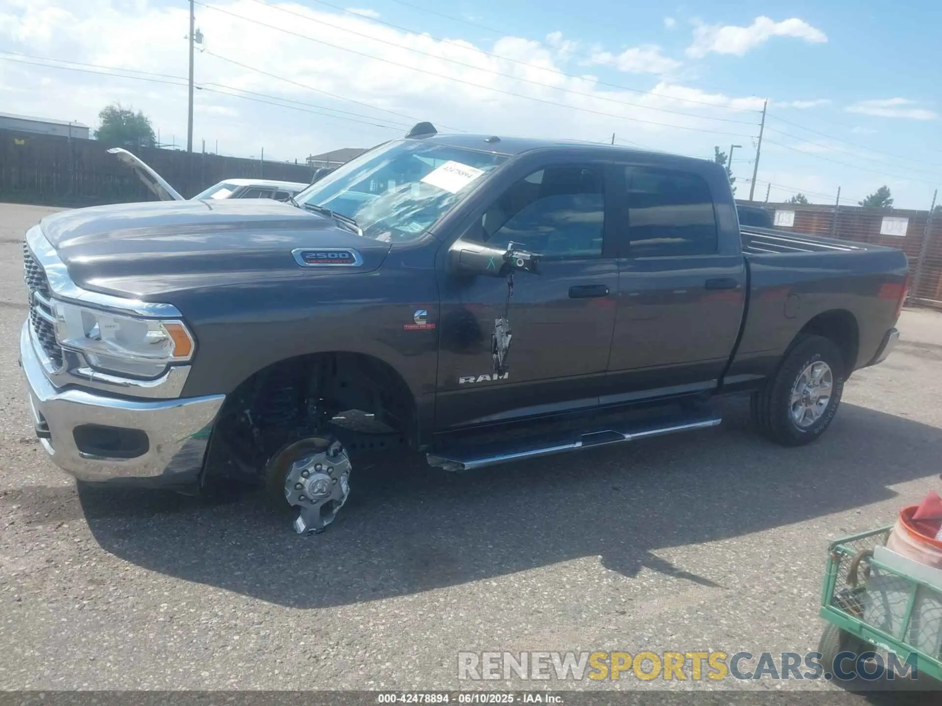 14 Photograph of a damaged car 3C6UR5DL4RG303677 RAM 2500 2024