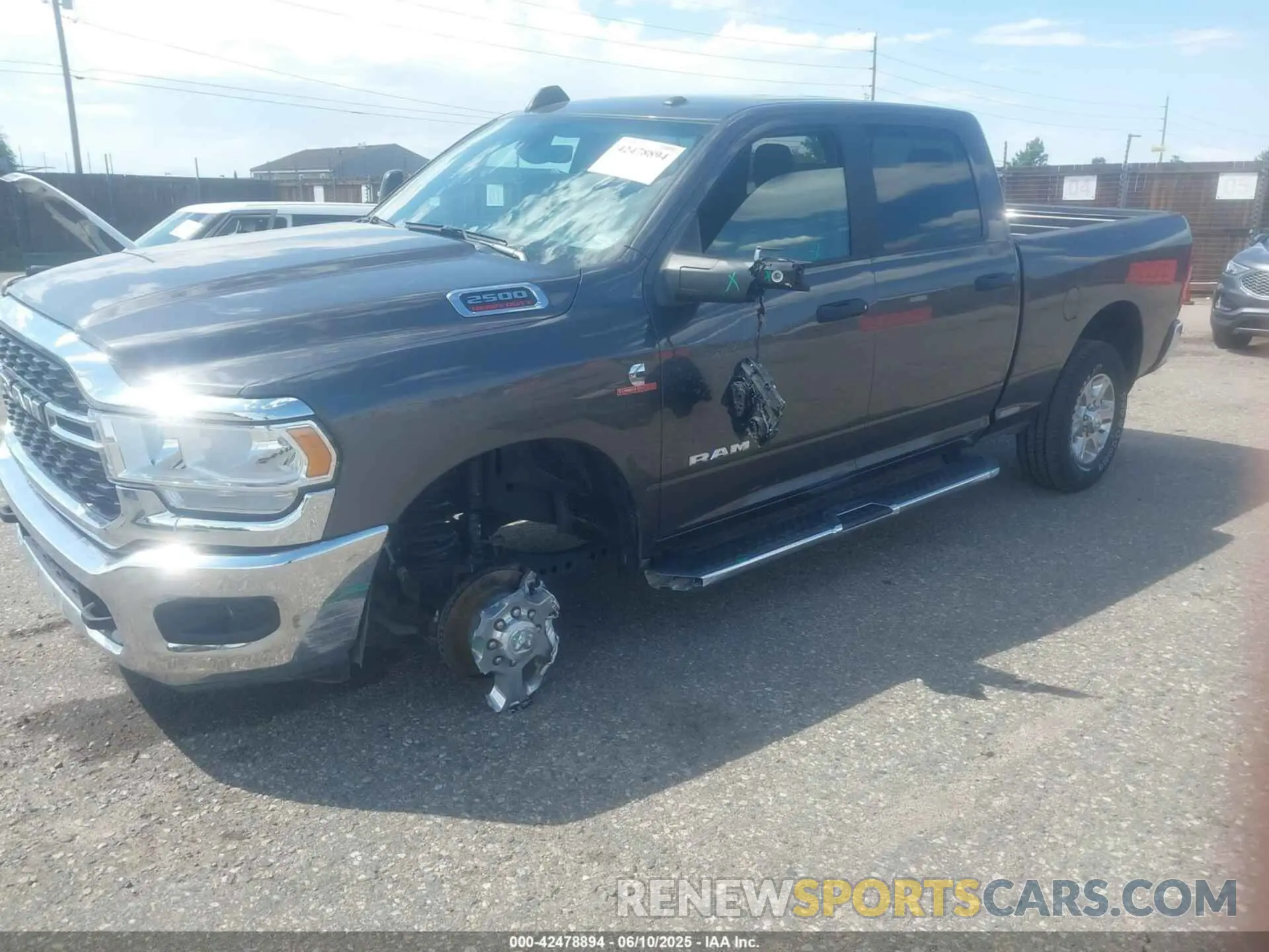 2 Photograph of a damaged car 3C6UR5DL4RG303677 RAM 2500 2024