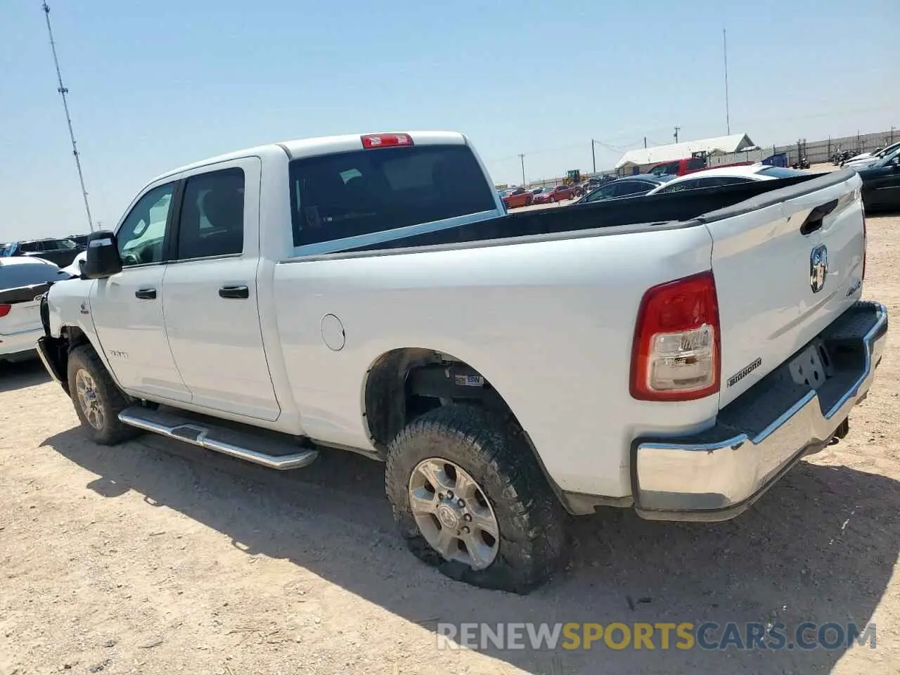 2 Photograph of a damaged car 3C6UR5DL6RG105991 RAM 2500 2024