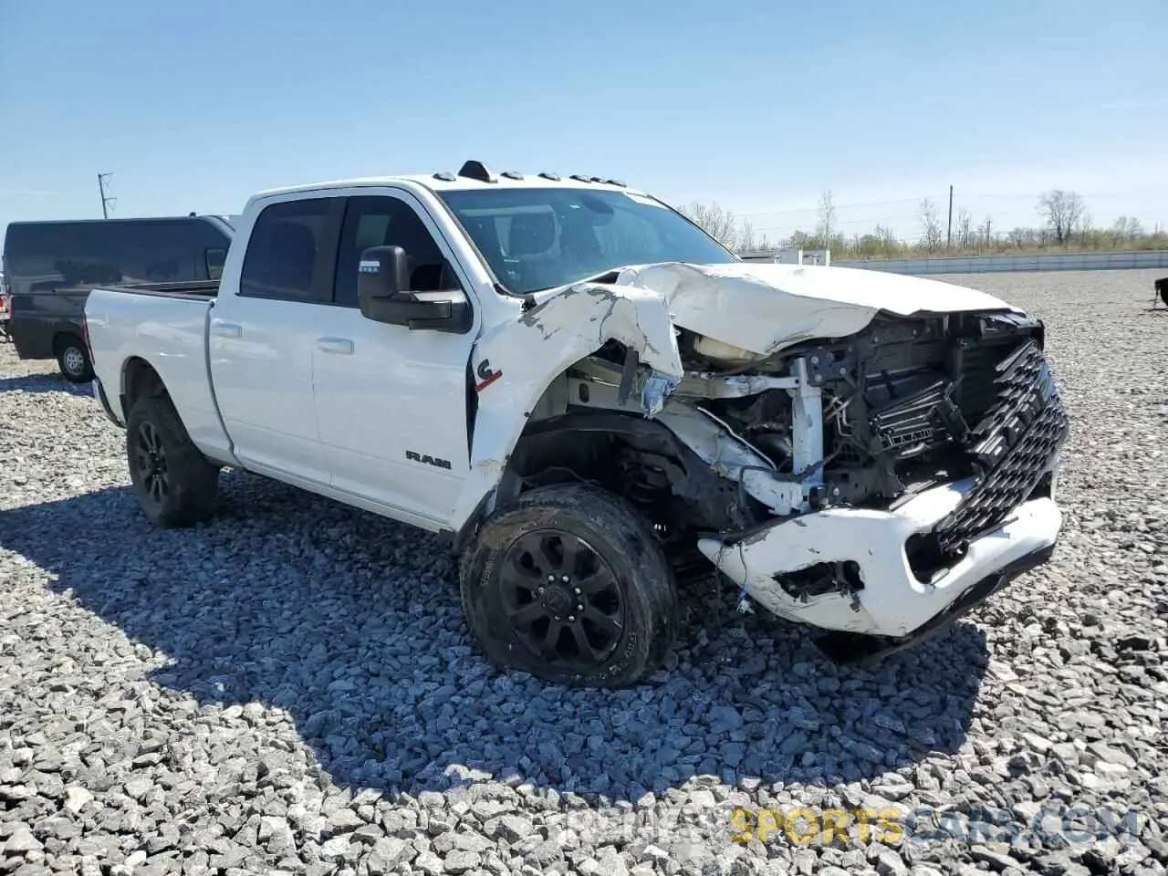 4 Photograph of a damaged car 3C6UR5DL7RG216615 RAM 2500 2024