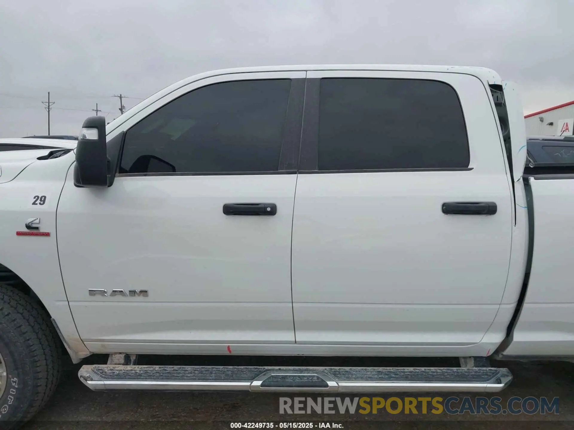 15 Photograph of a damaged car 3C6UR5DL8RG233858 RAM 2500 2024