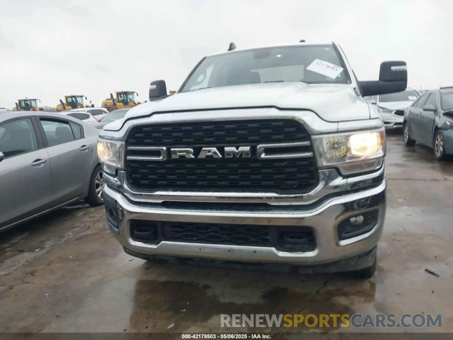 12 Photograph of a damaged car 3C6UR5DL8RG303908 RAM 2500 2024
