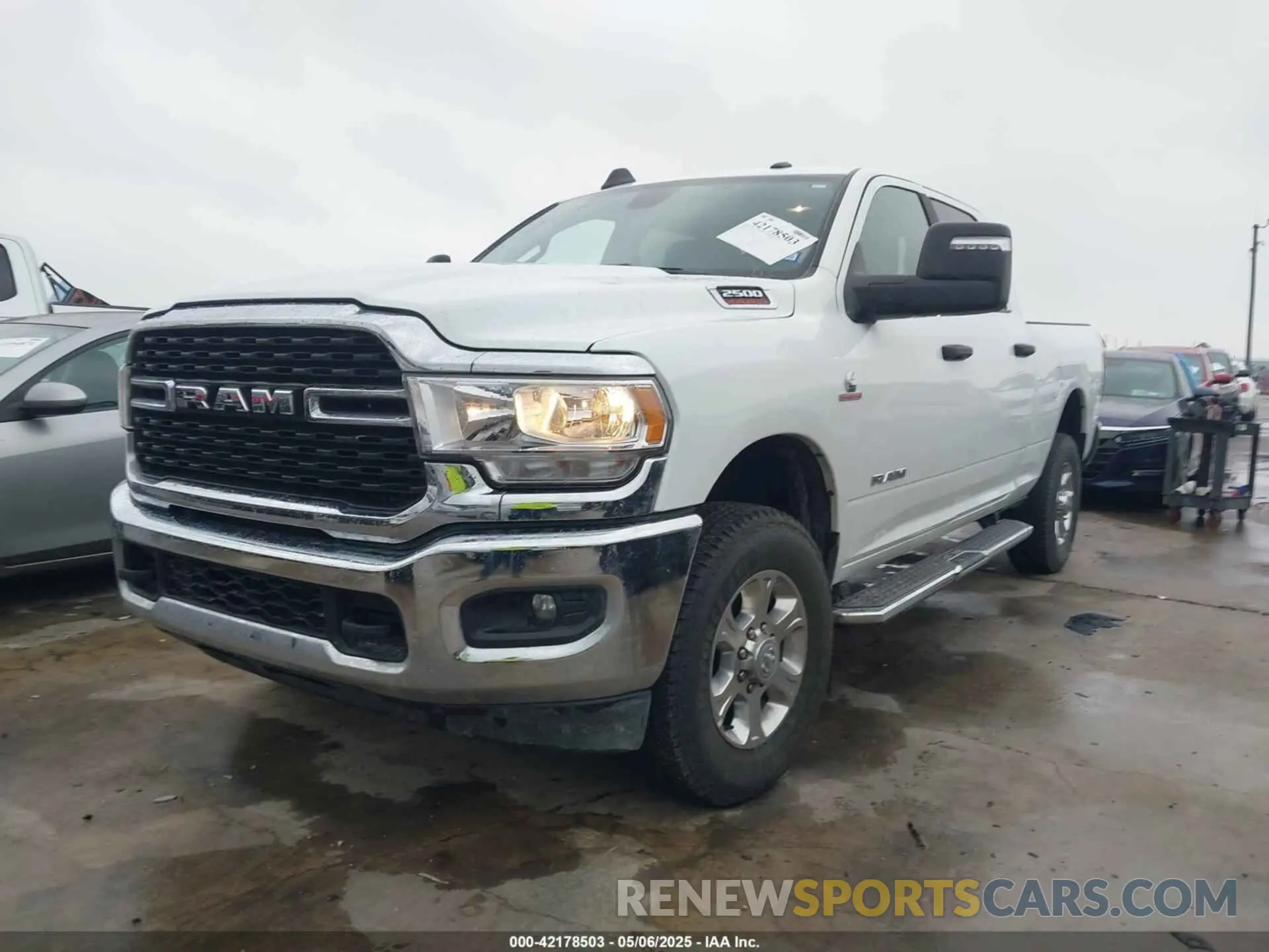 2 Photograph of a damaged car 3C6UR5DL8RG303908 RAM 2500 2024