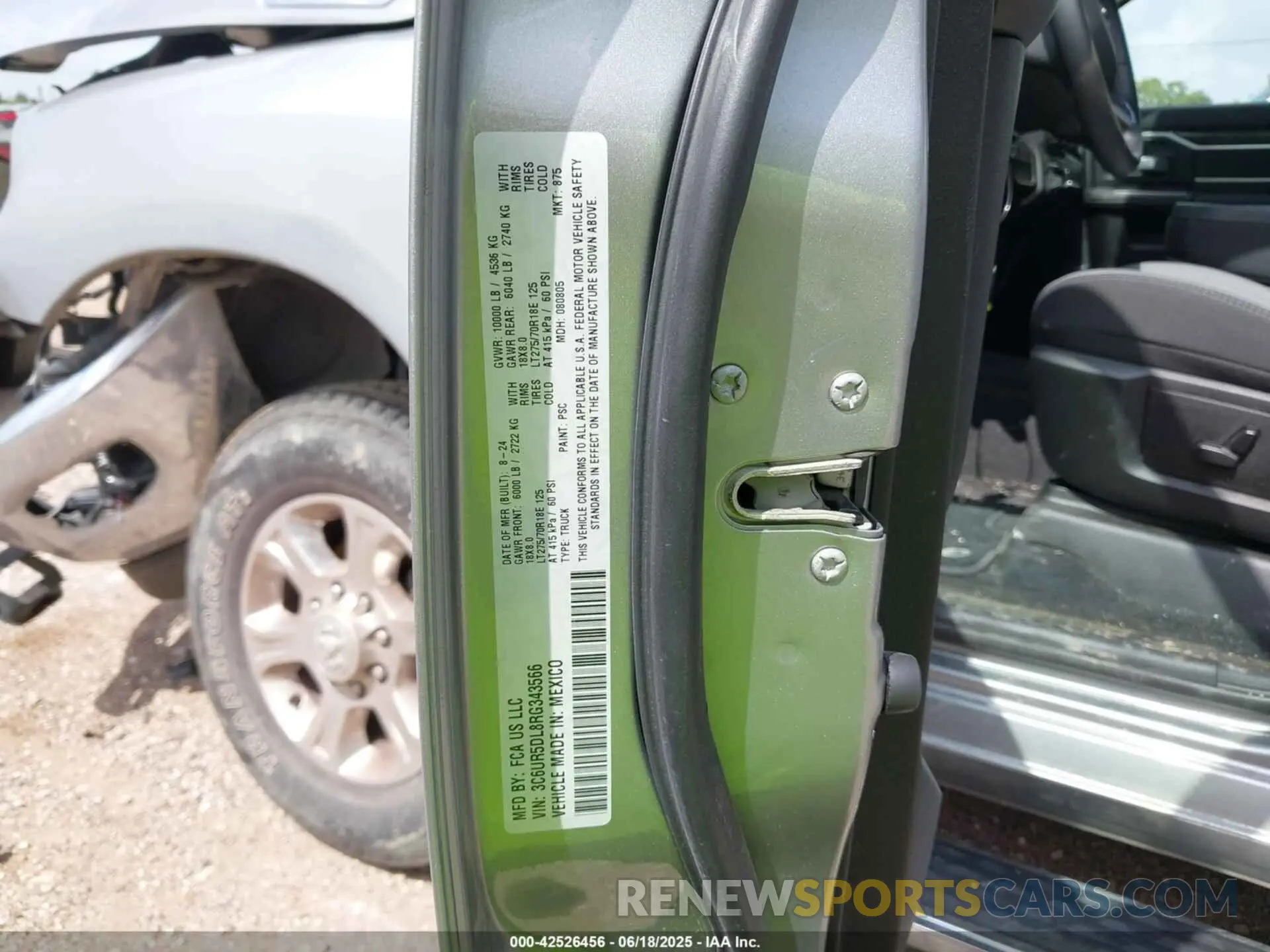 9 Photograph of a damaged car 3C6UR5DL8RG343566 RAM 2500 2024