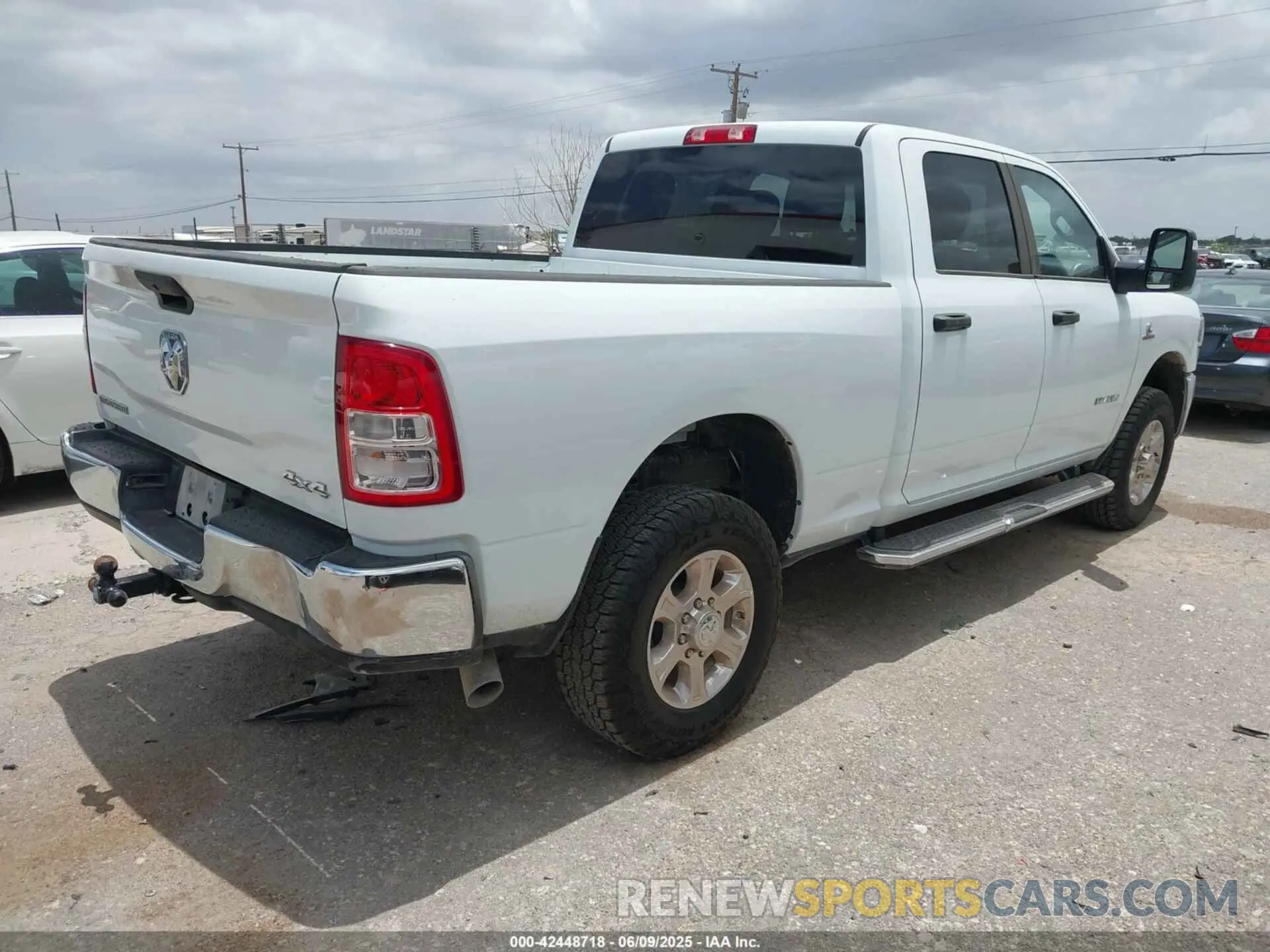 4 Photograph of a damaged car 3C6UR5DL9RG154280 RAM 2500 2024