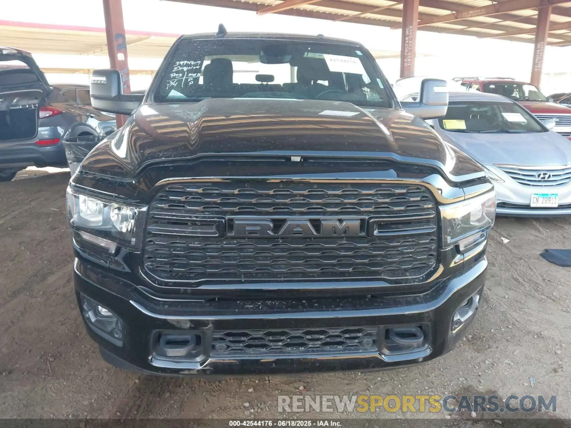 12 Photograph of a damaged car 3C6UR5DL9RG222903 RAM 2500 2024