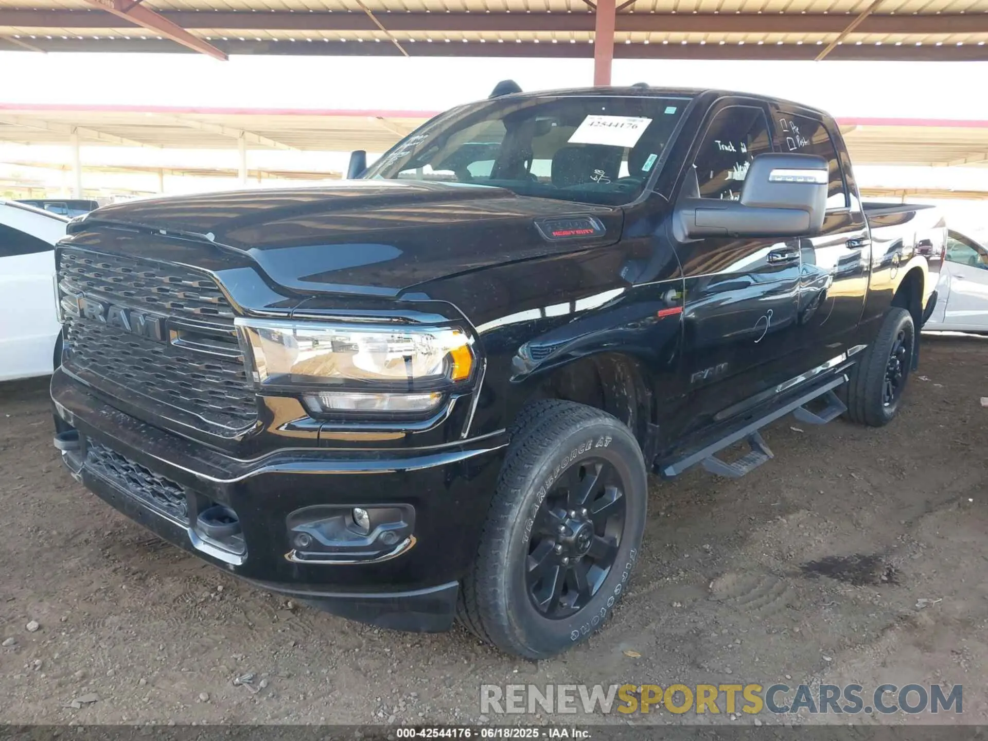 2 Photograph of a damaged car 3C6UR5DL9RG222903 RAM 2500 2024