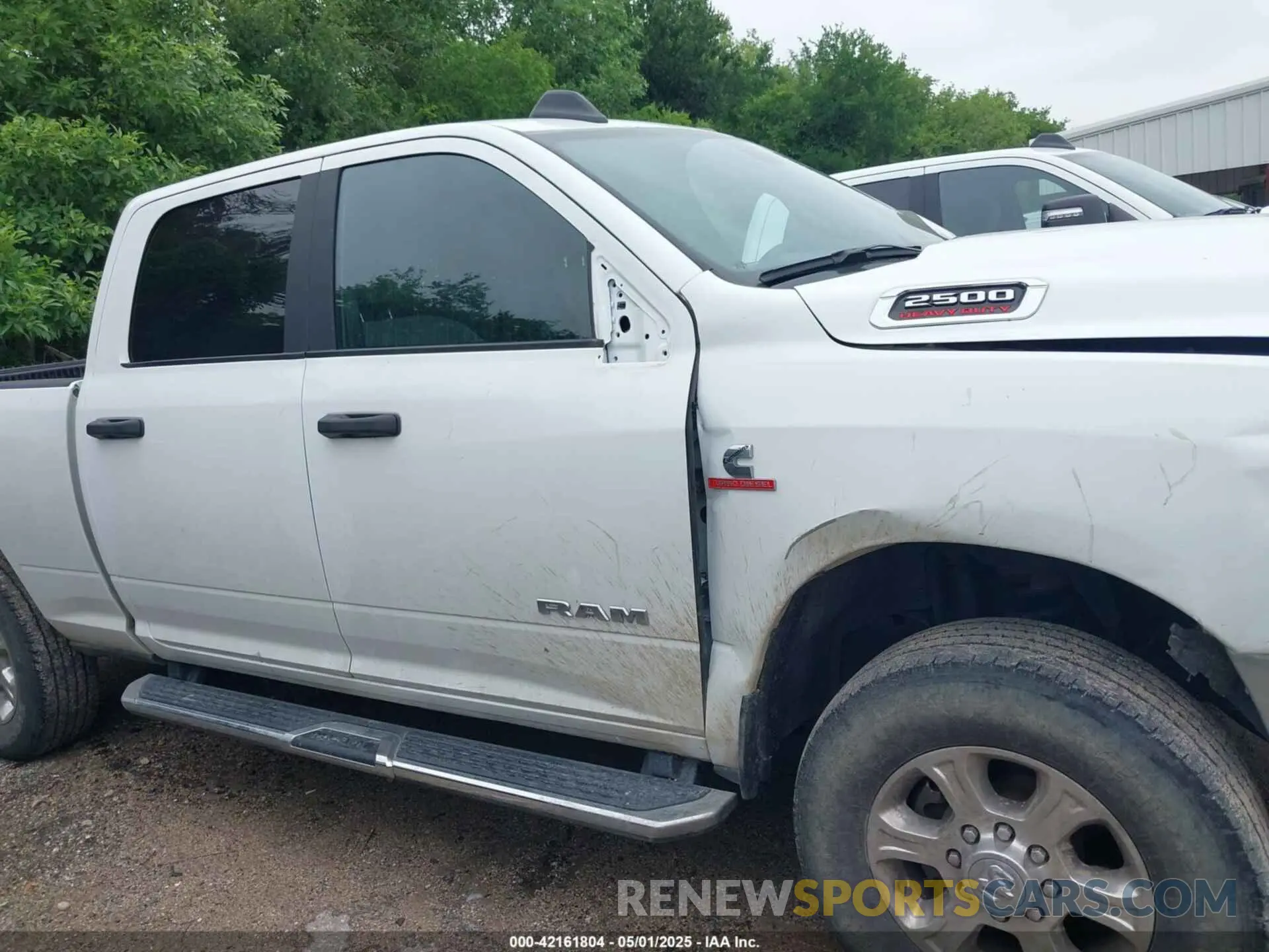 13 Photograph of a damaged car 3C6UR5DL9RG283488 RAM 2500 2024