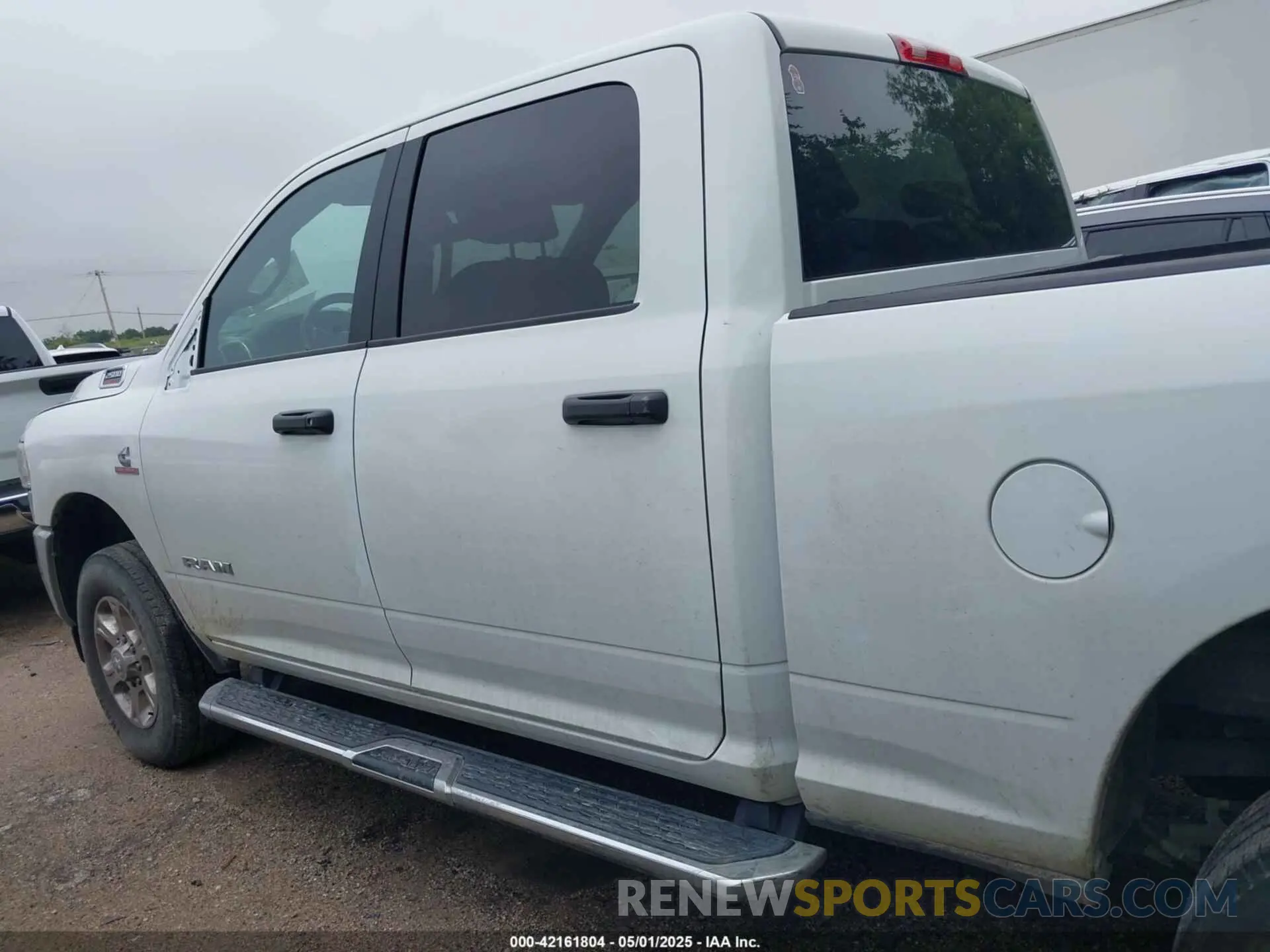 14 Photograph of a damaged car 3C6UR5DL9RG283488 RAM 2500 2024