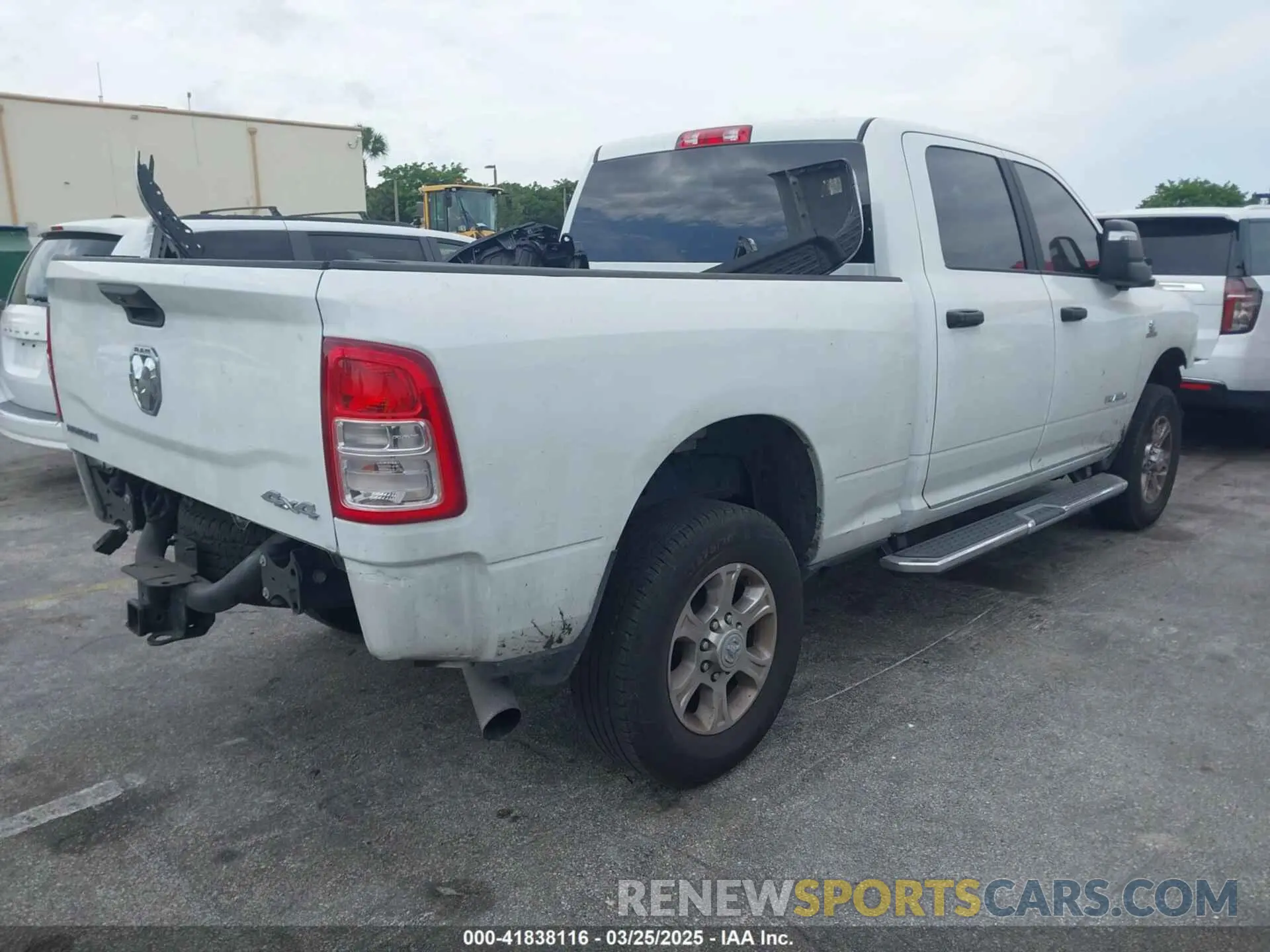 4 Photograph of a damaged car 3C6UR5DL9RG297746 RAM 2500 2024