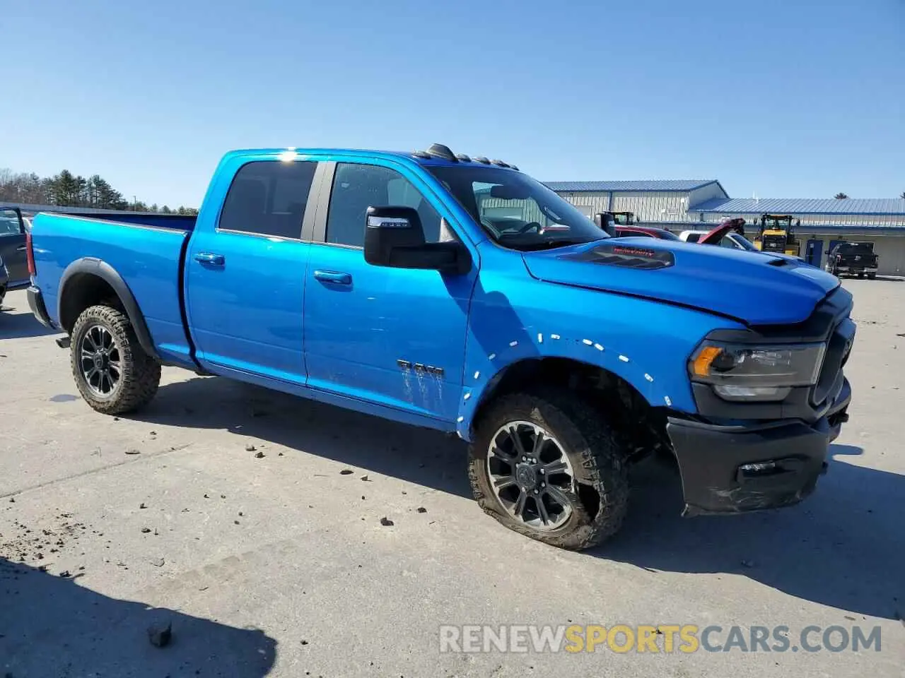 4 Photograph of a damaged car 3C6UR5EJ7RG140360 RAM 2500 2024