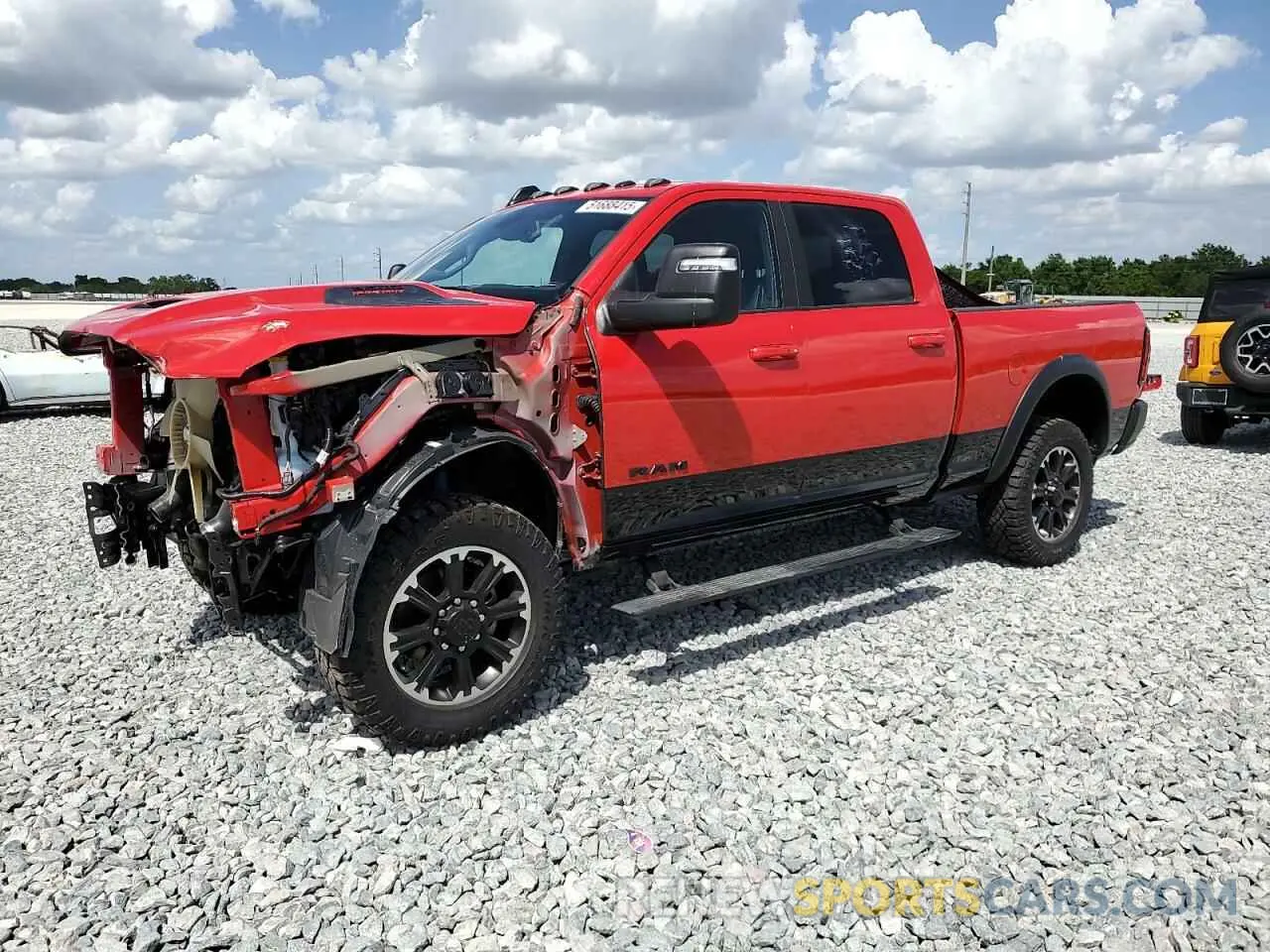 1 Photograph of a damaged car 3C6UR5EL0RG207351 RAM 2500 2024