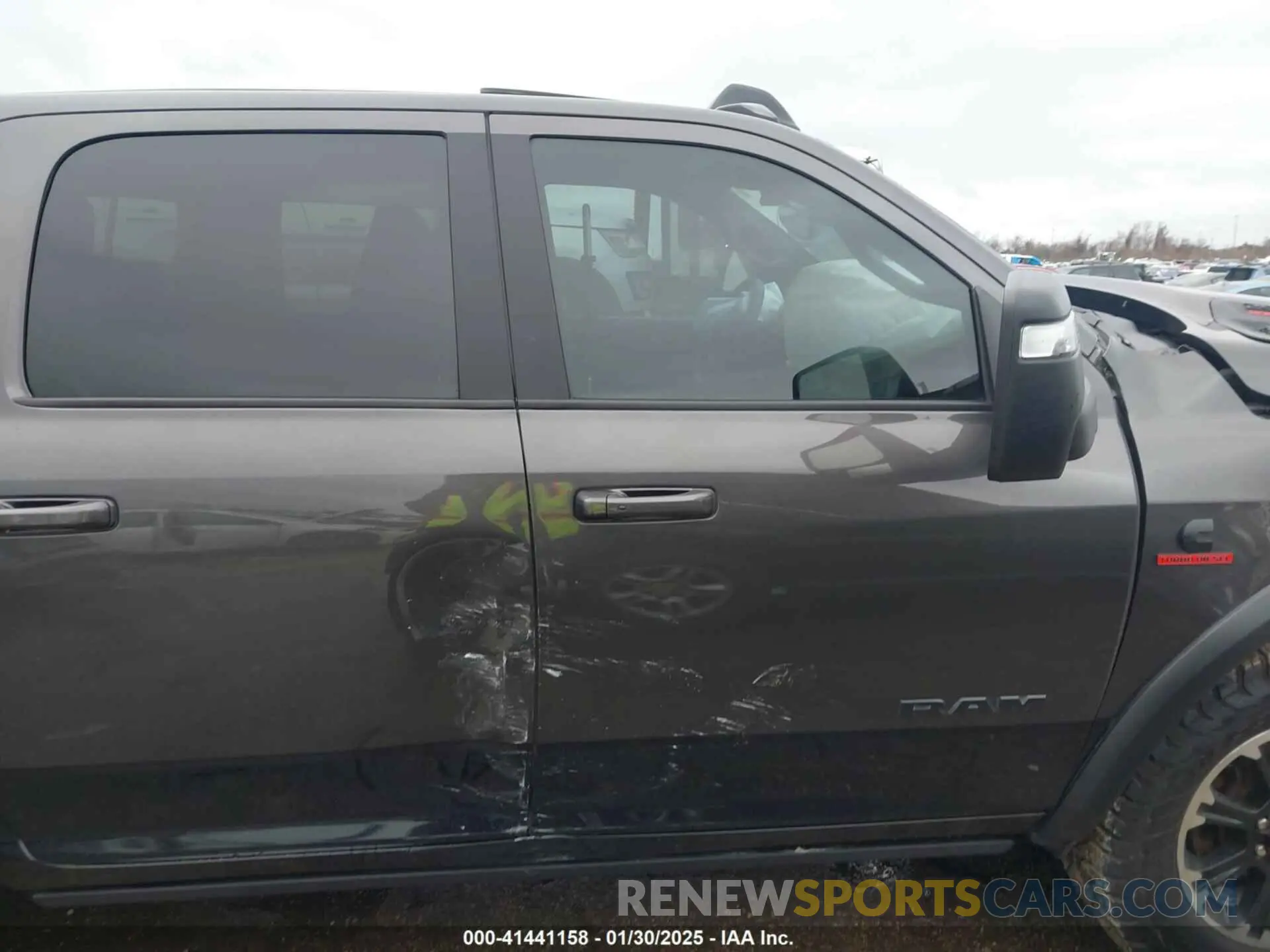 14 Photograph of a damaged car 3C6UR5EL1RG158371 RAM 2500 2024