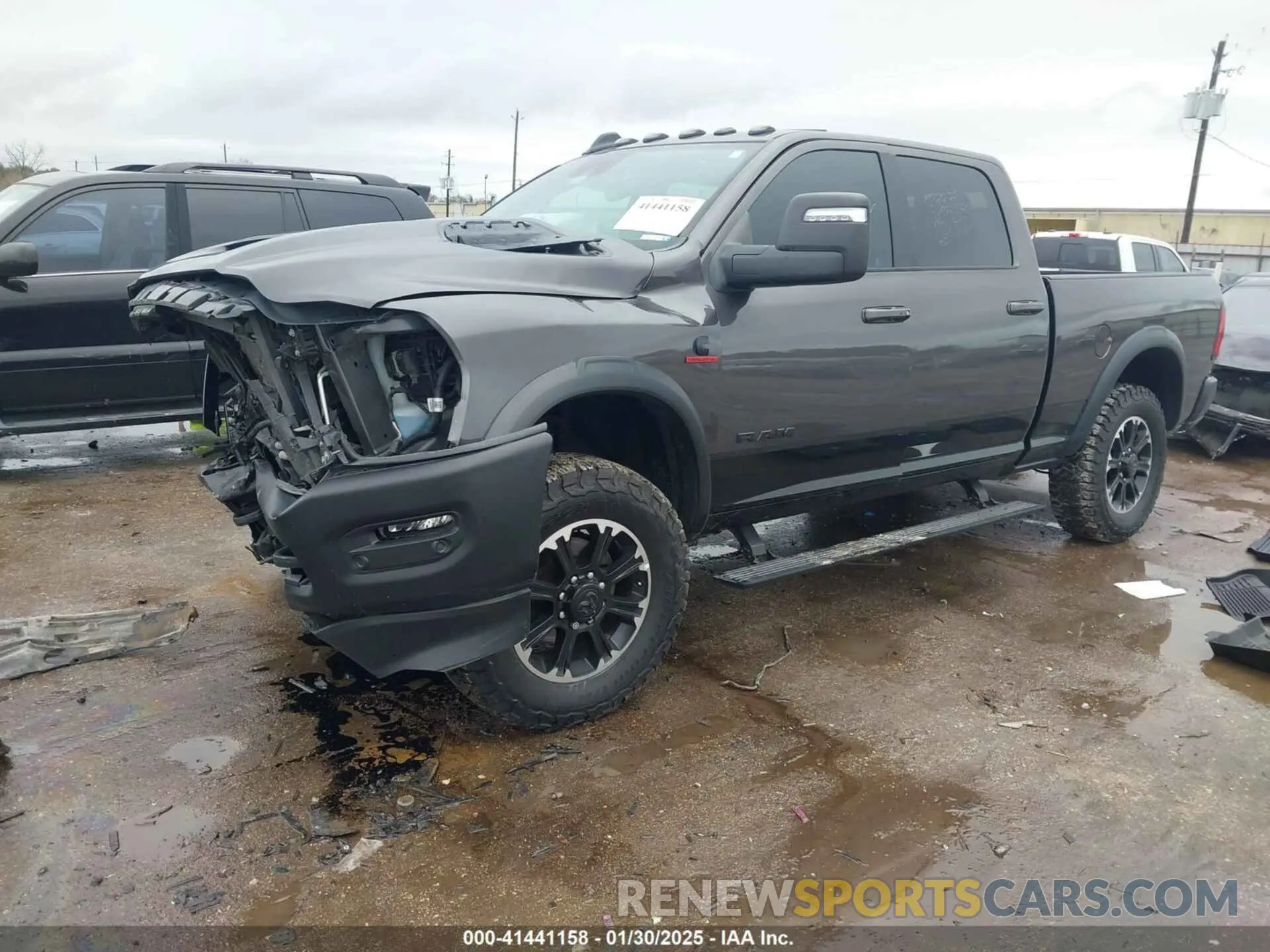 2 Photograph of a damaged car 3C6UR5EL1RG158371 RAM 2500 2024