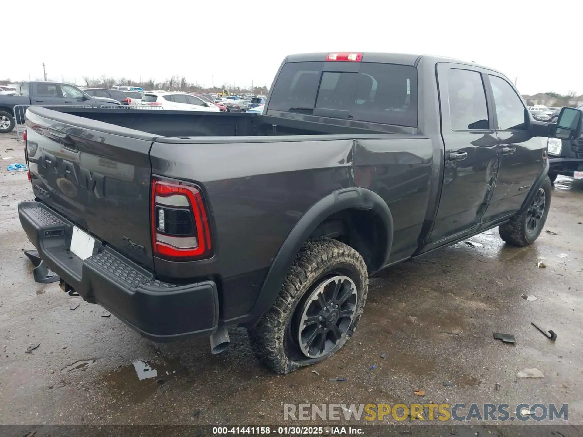 4 Photograph of a damaged car 3C6UR5EL1RG158371 RAM 2500 2024