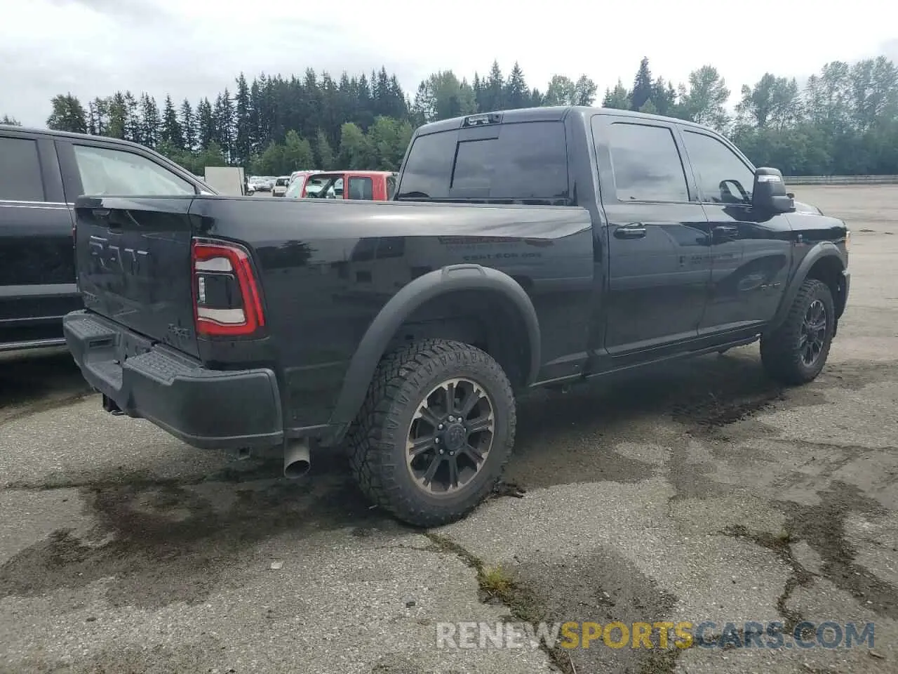 3 Photograph of a damaged car 3C6UR5EL4RG131875 RAM 2500 2024