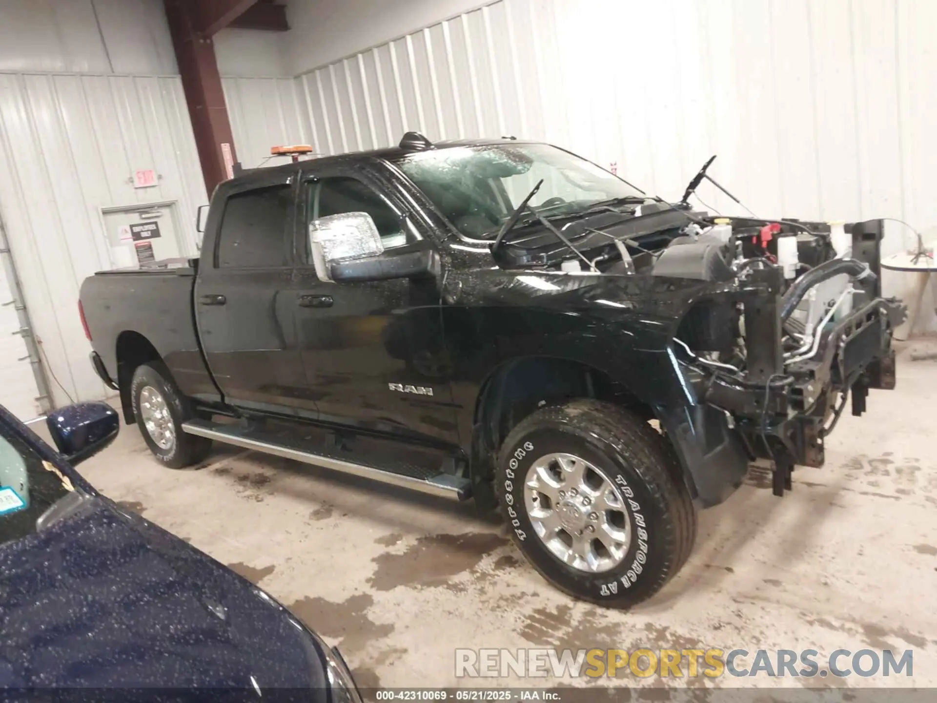 14 Photograph of a damaged car 3C6UR5FJ2RG186581 RAM 2500 2024