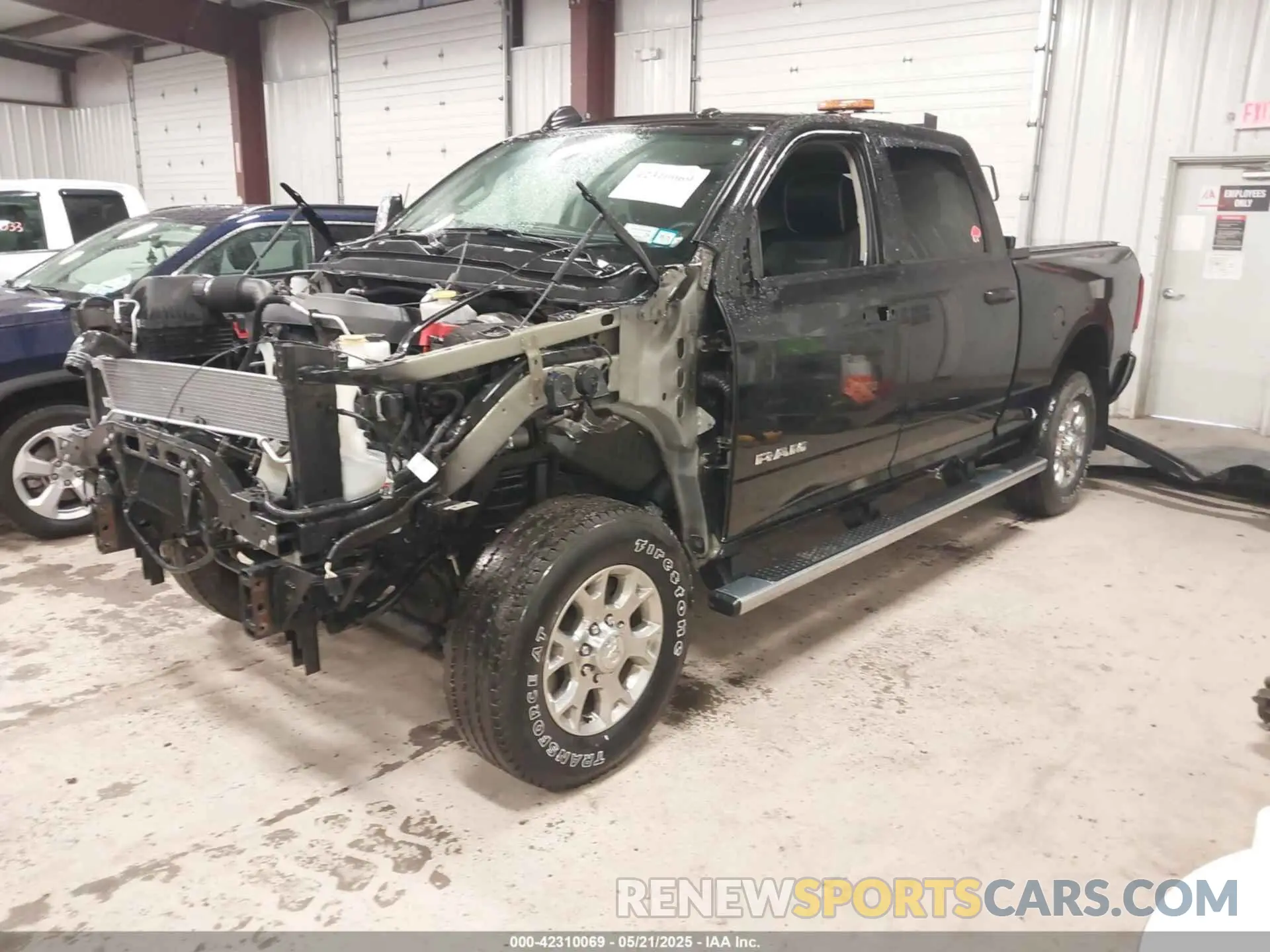 2 Photograph of a damaged car 3C6UR5FJ2RG186581 RAM 2500 2024
