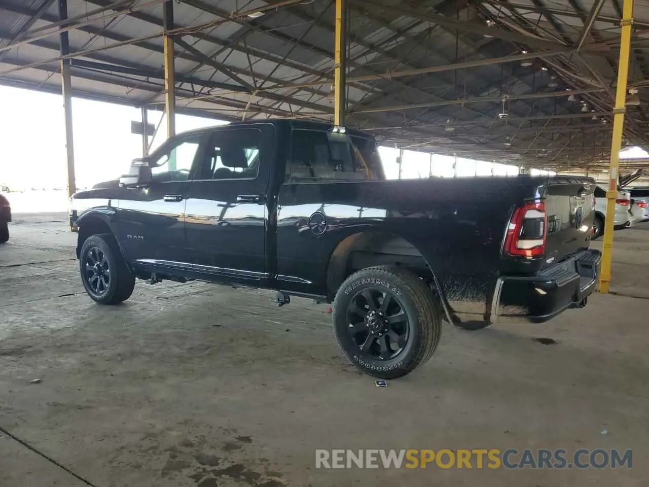 2 Photograph of a damaged car 3C6UR5FJ3RG188176 RAM 2500 2024
