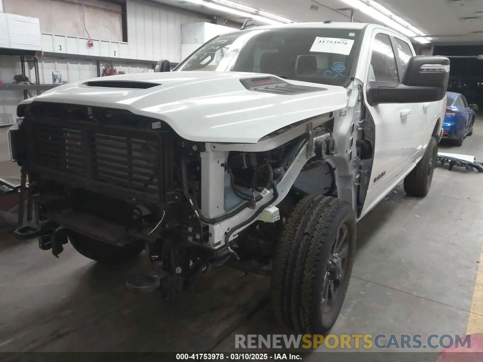 2 Photograph of a damaged car 3C6UR5FJ7RG143466 RAM 2500 2024