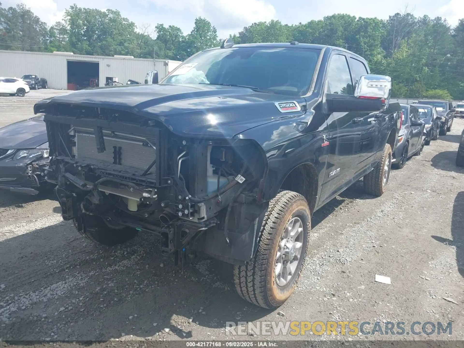 2 Photograph of a damaged car 3C6UR5FL3RG407946 RAM 2500 2024