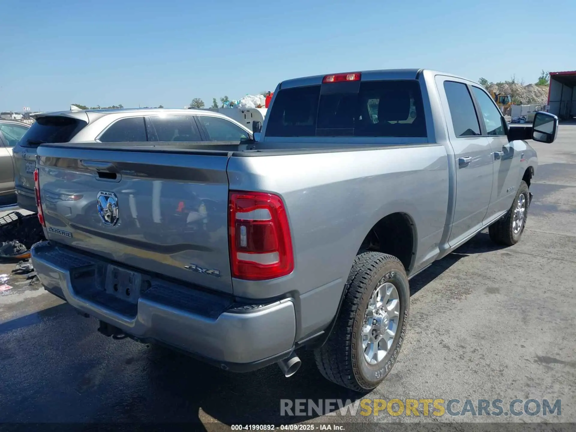 4 Photograph of a damaged car 3C6UR5FL4RG367117 RAM 2500 2024
