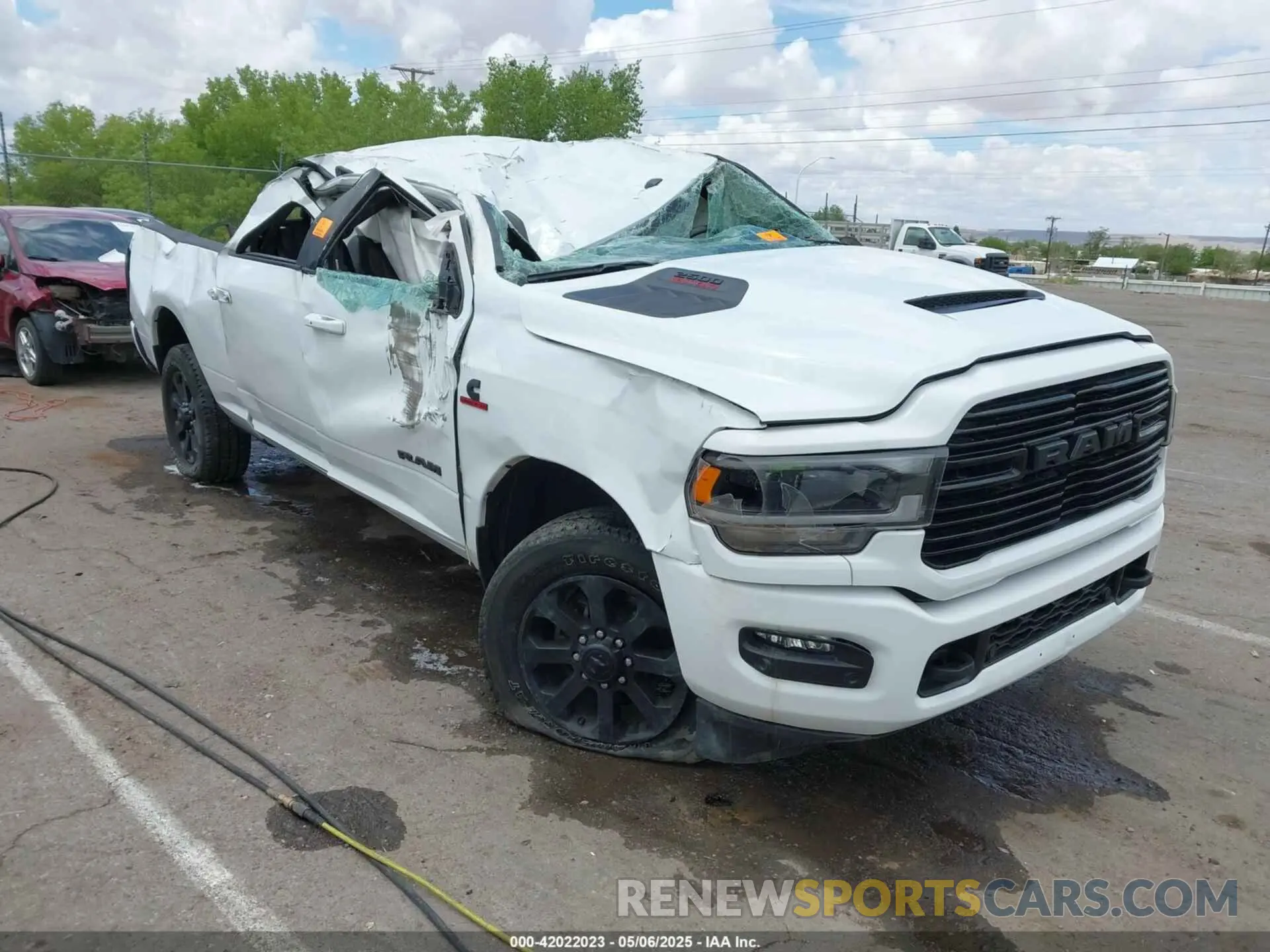 1 Photograph of a damaged car 3C6UR5FL6RG288306 RAM 2500 2024