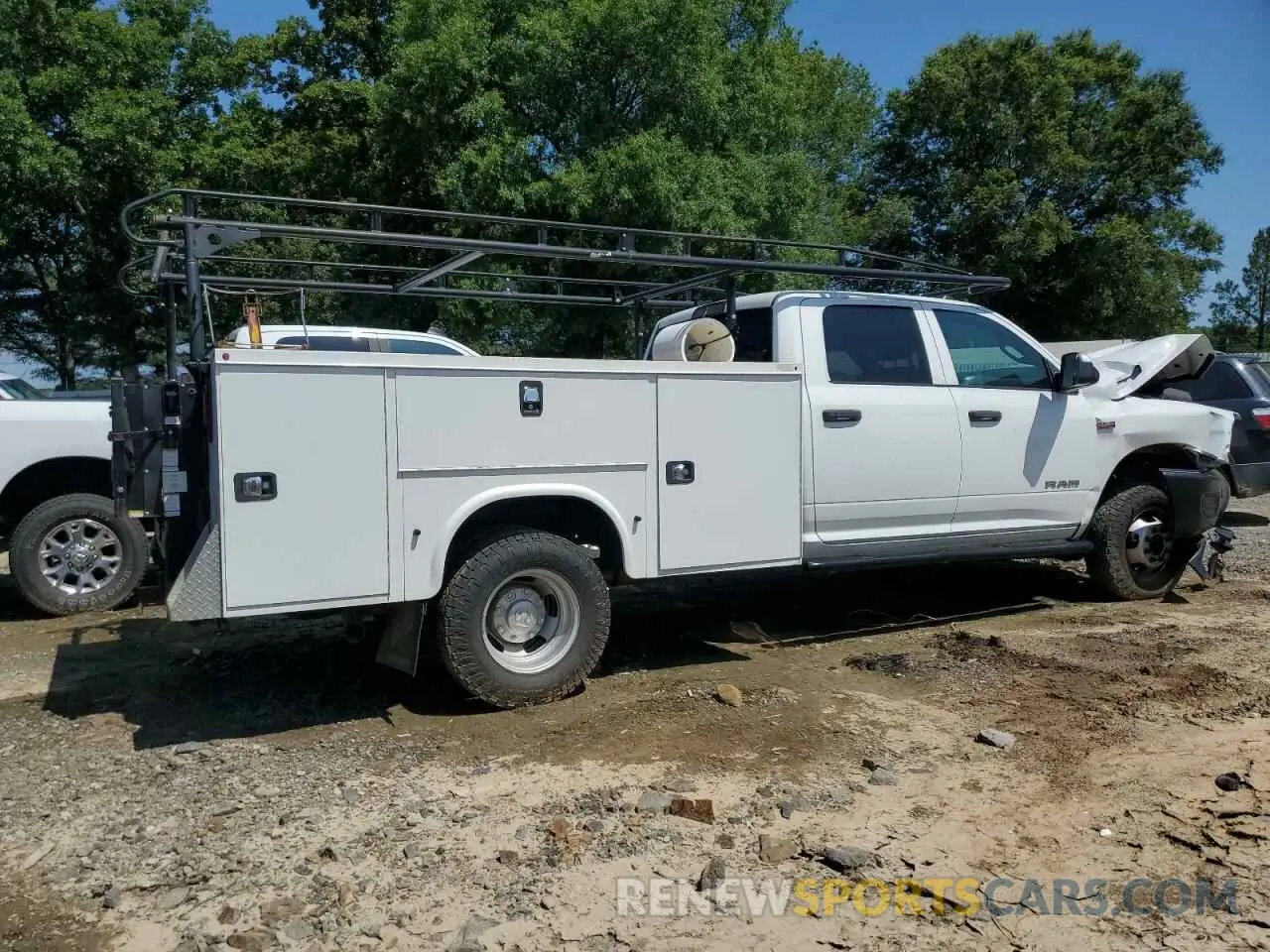 3 Photograph of a damaged car 3C6UR5FL6RG366874 RAM 2500 2024