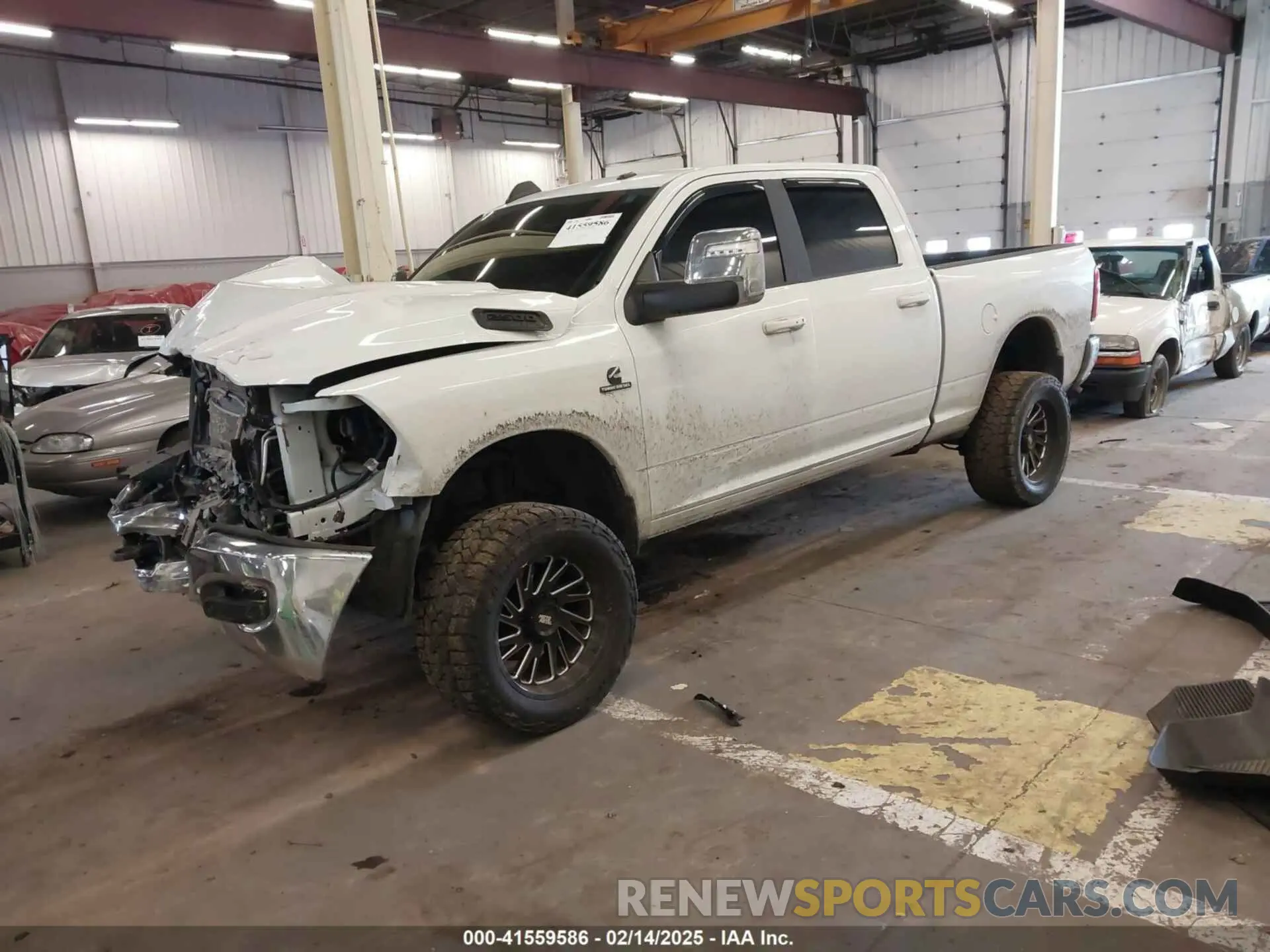2 Photograph of a damaged car 3C6UR5FLXRG213074 RAM 2500 2024