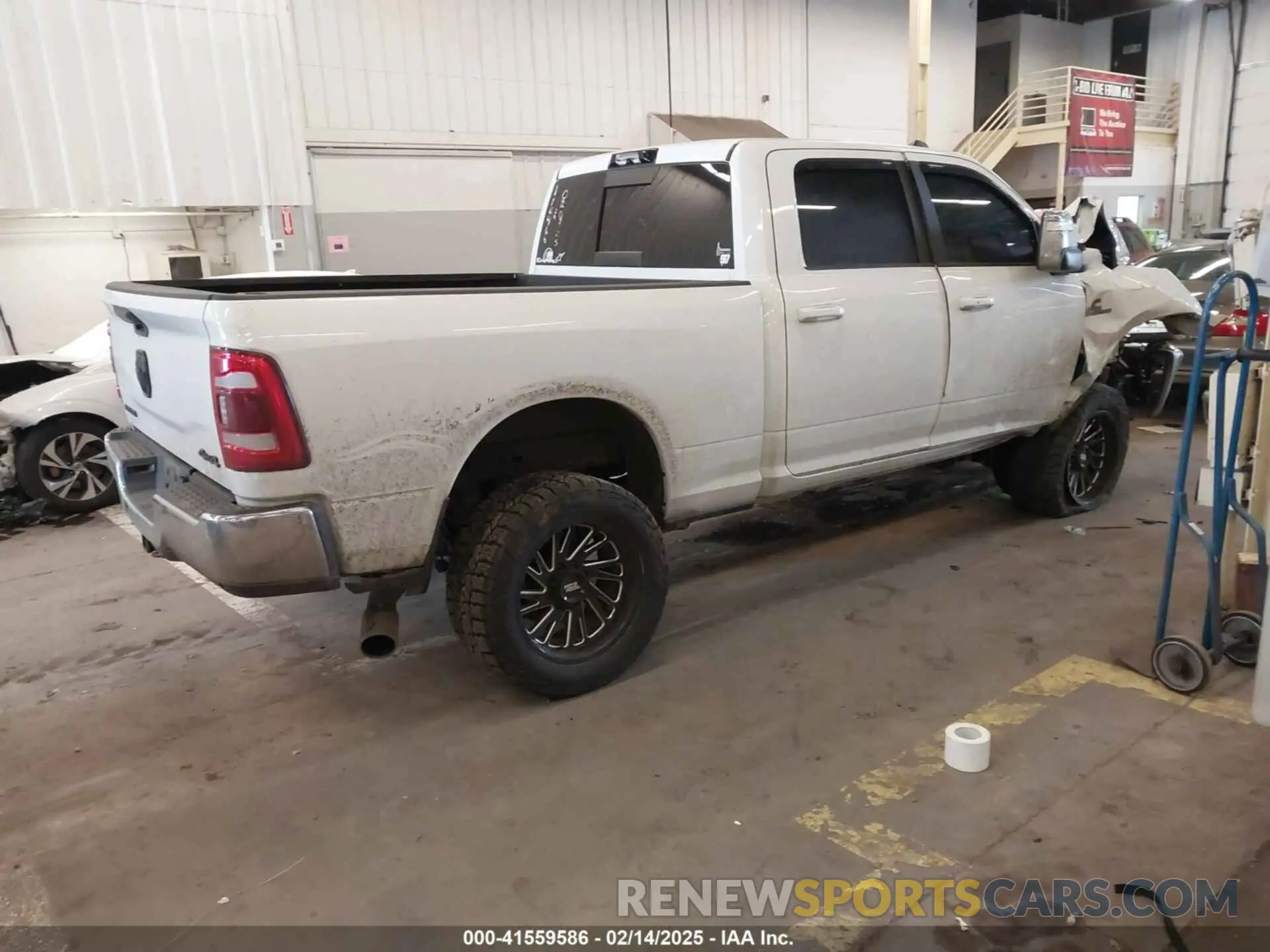 4 Photograph of a damaged car 3C6UR5FLXRG213074 RAM 2500 2024