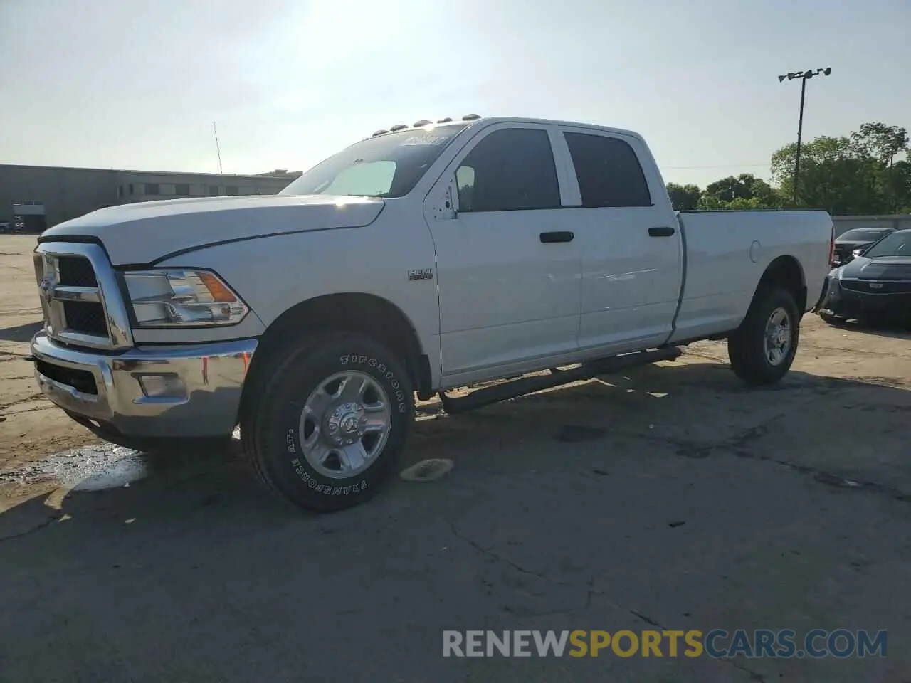 1 Photograph of a damaged car 3C6UR5HJ2RG230415 RAM 2500 2024