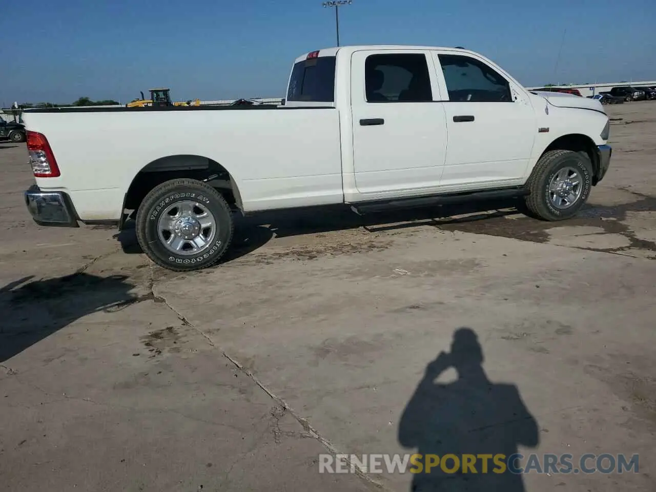 3 Photograph of a damaged car 3C6UR5HJ2RG230415 RAM 2500 2024