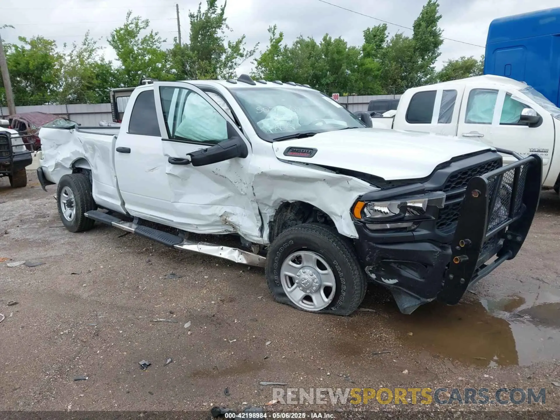 1 Photograph of a damaged car 3C6UR5HJ4RG125908 RAM 2500 2024