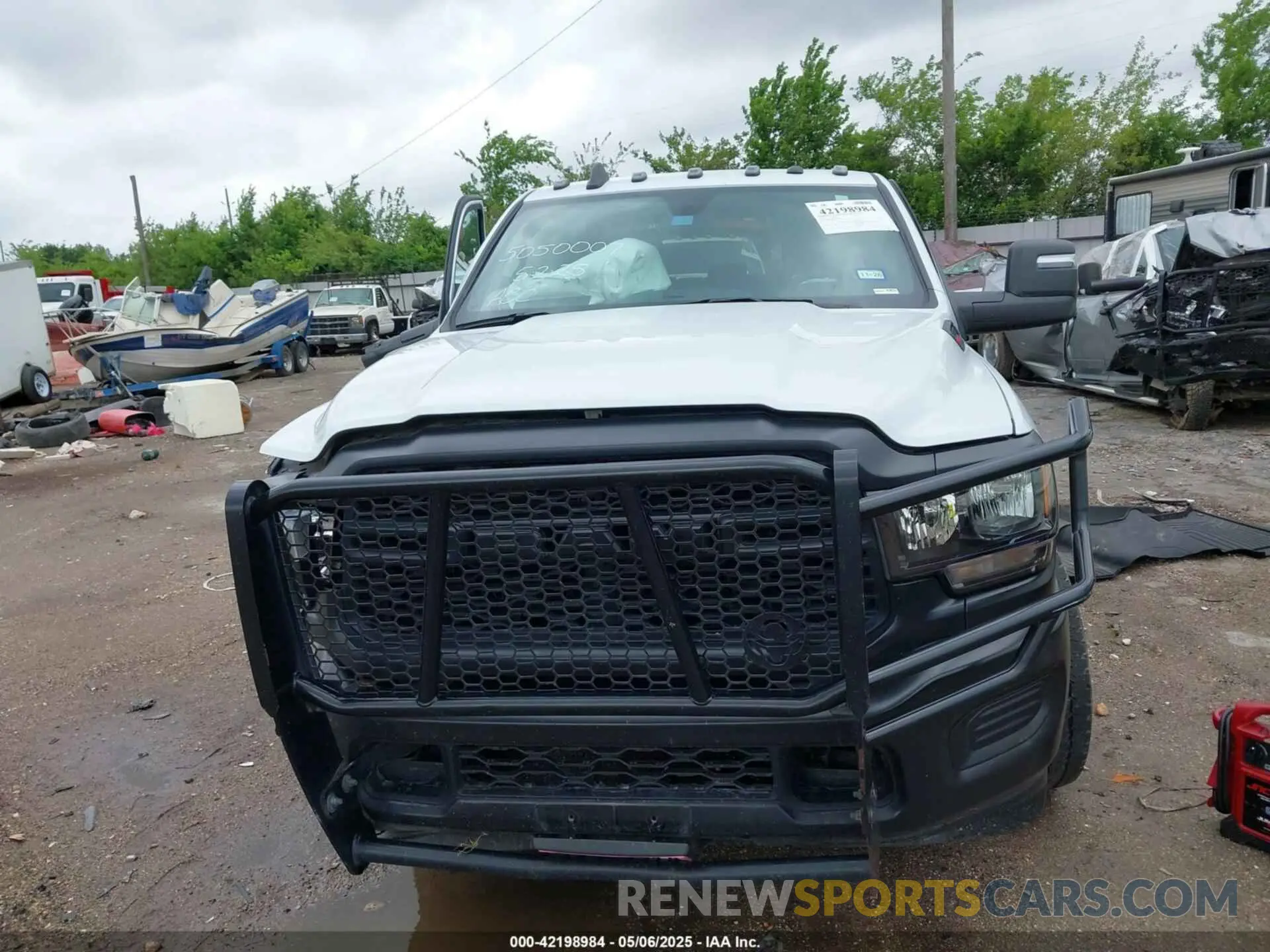 13 Photograph of a damaged car 3C6UR5HJ4RG125908 RAM 2500 2024