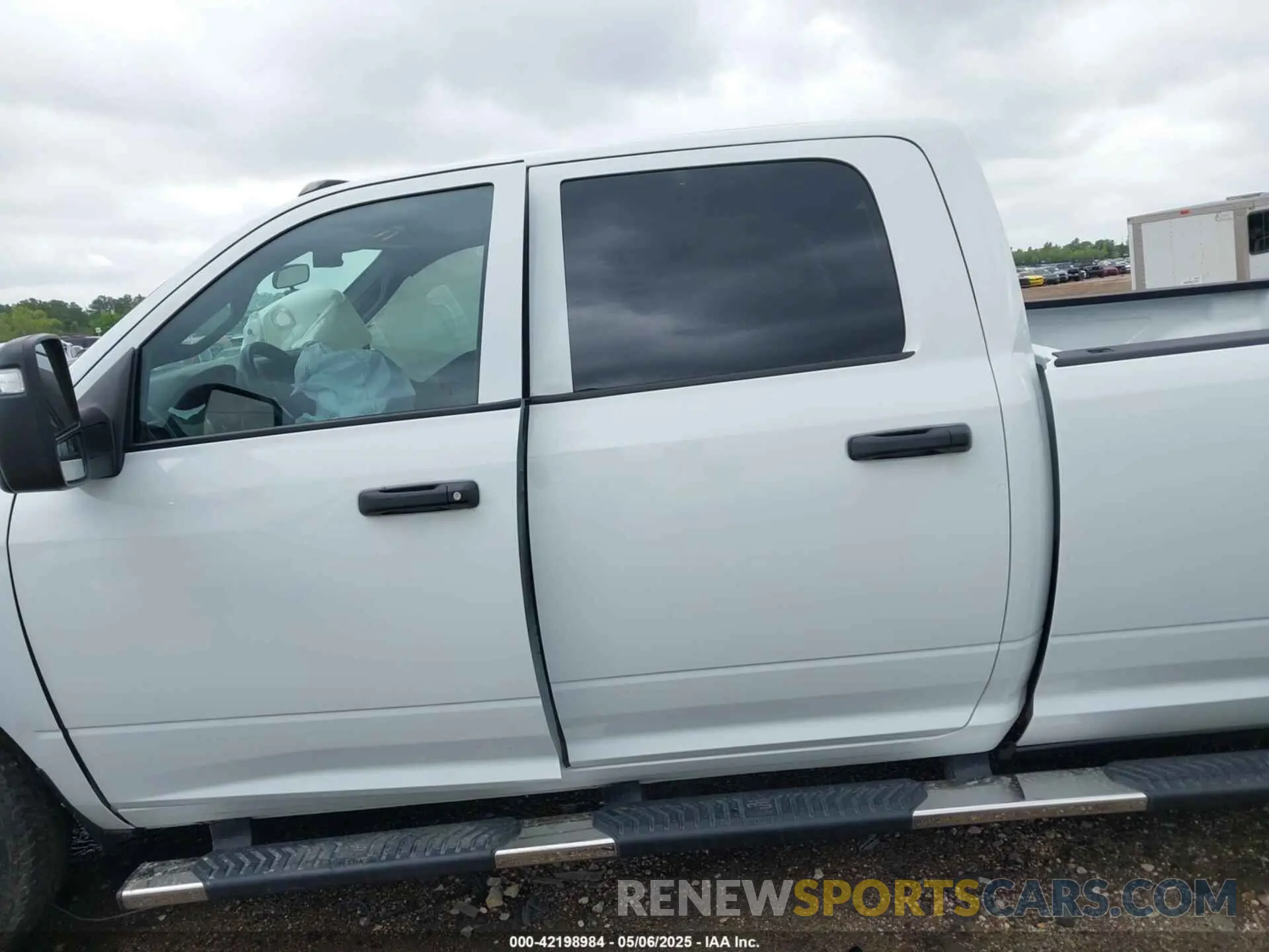 15 Photograph of a damaged car 3C6UR5HJ4RG125908 RAM 2500 2024
