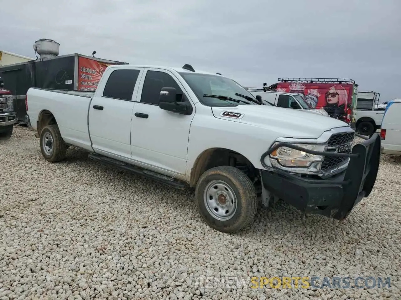 4 Photograph of a damaged car 3C6UR5HJ7RG139575 RAM 2500 2024