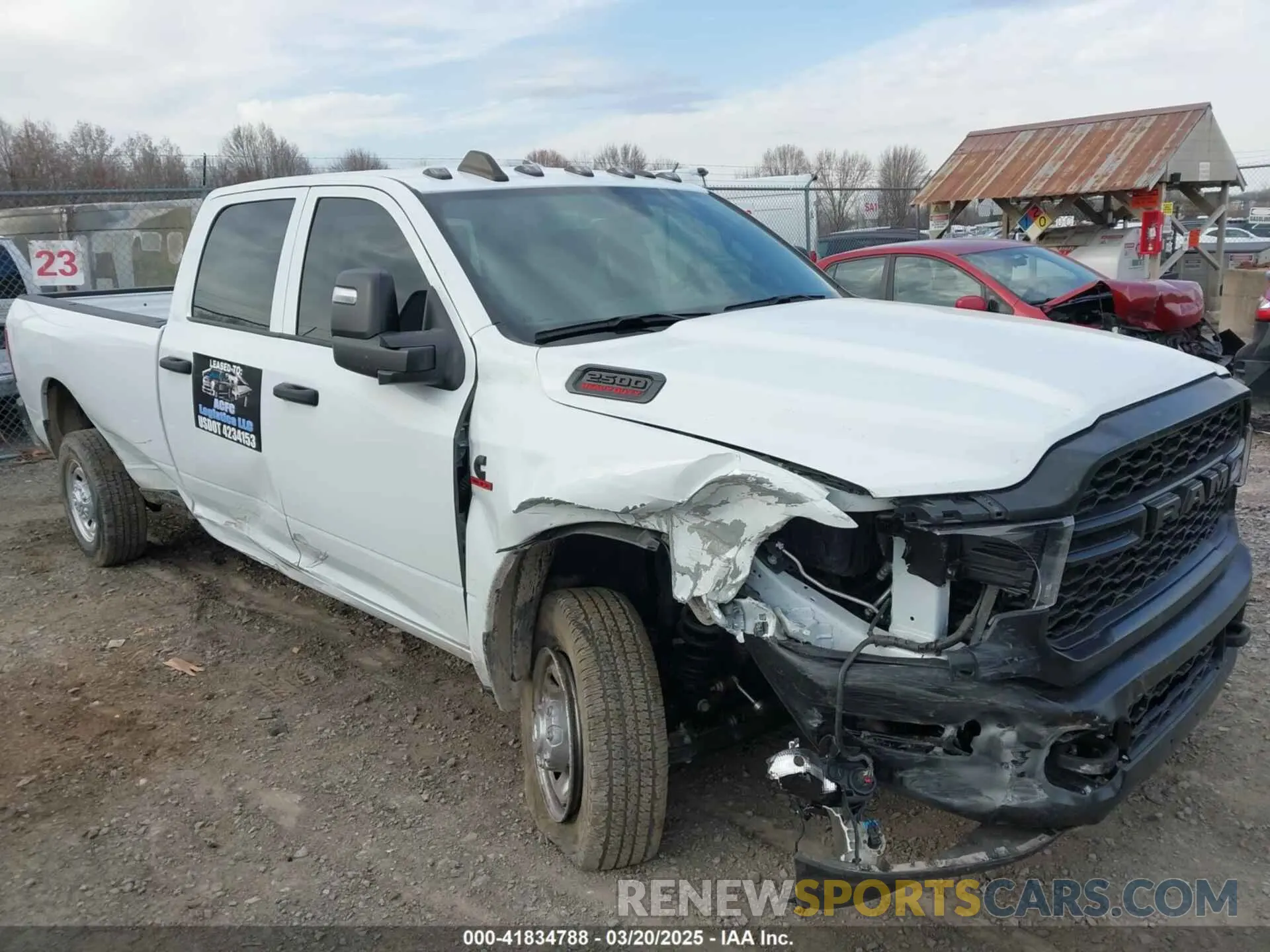 1 Photograph of a damaged car 3C6UR5HL4RG156559 RAM 2500 2024