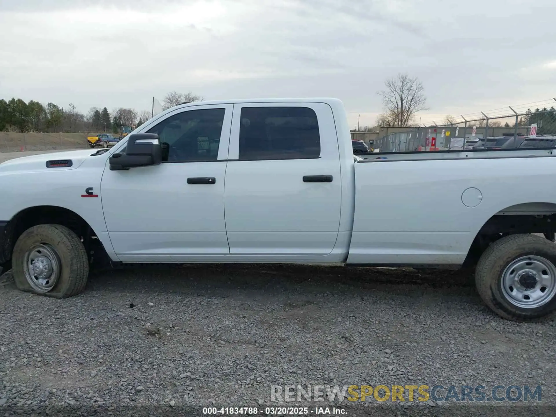 14 Photograph of a damaged car 3C6UR5HL4RG156559 RAM 2500 2024