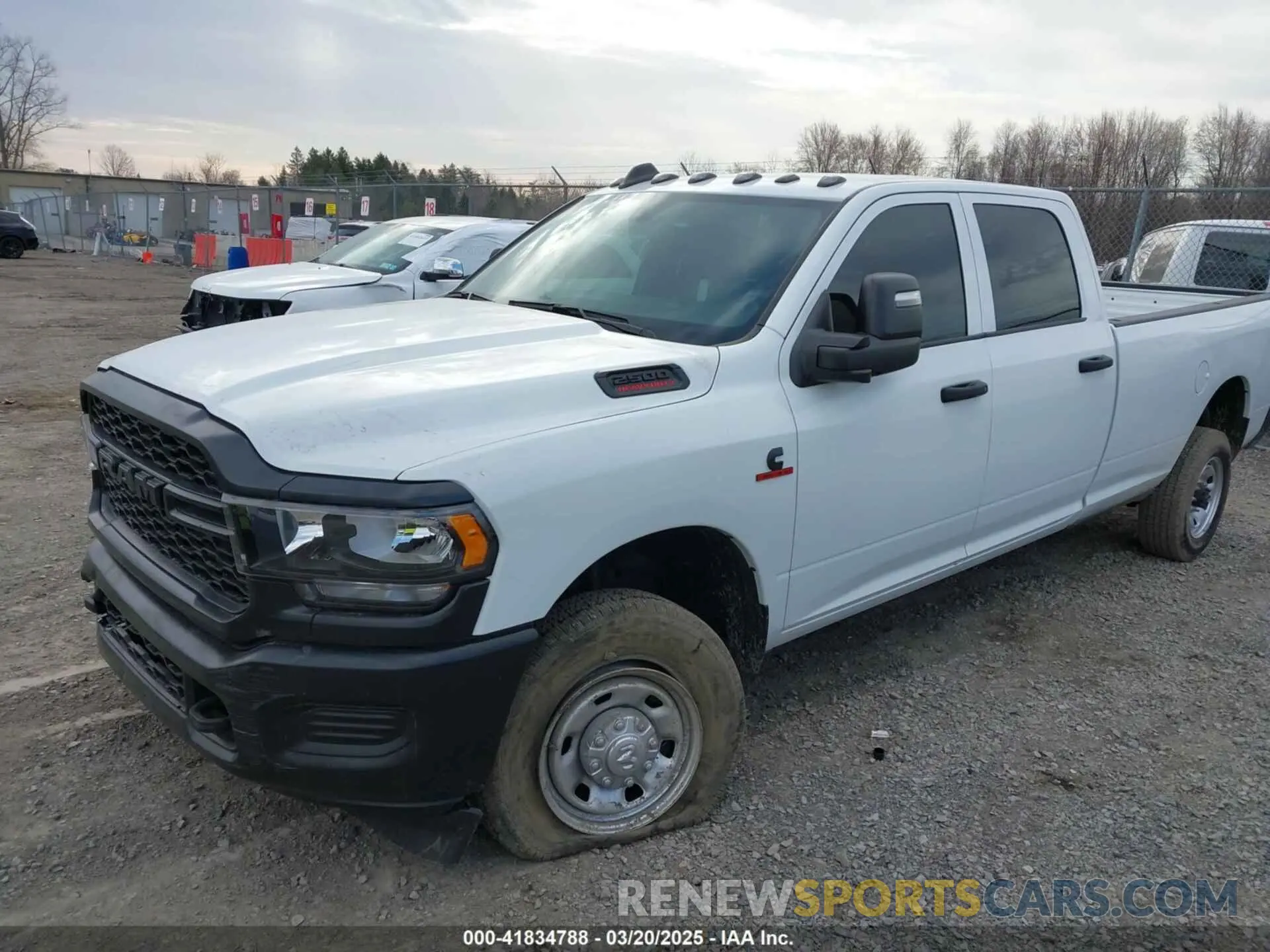 2 Photograph of a damaged car 3C6UR5HL4RG156559 RAM 2500 2024