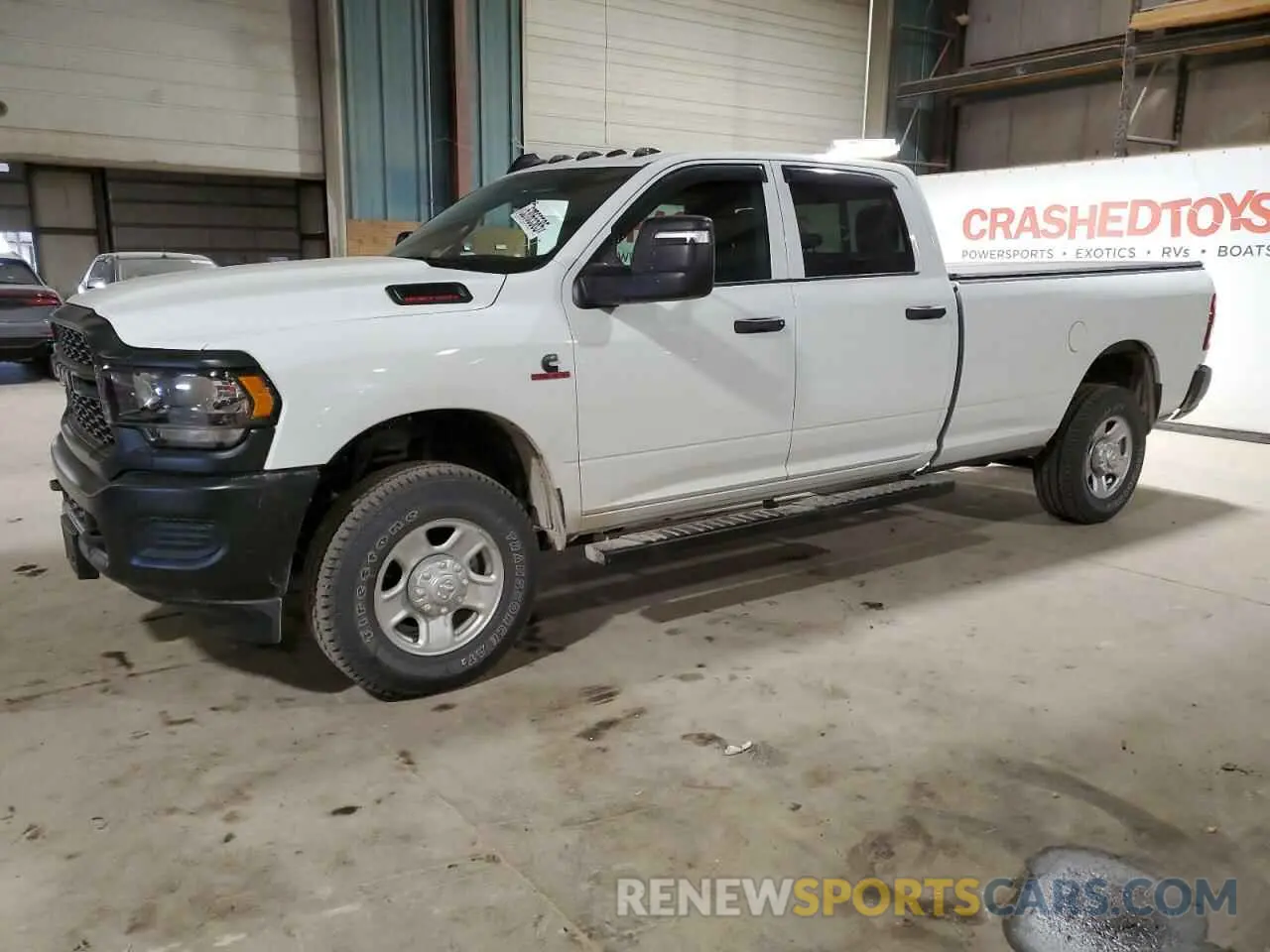 1 Photograph of a damaged car 3C6UR5HL6RG328526 RAM 2500 2024